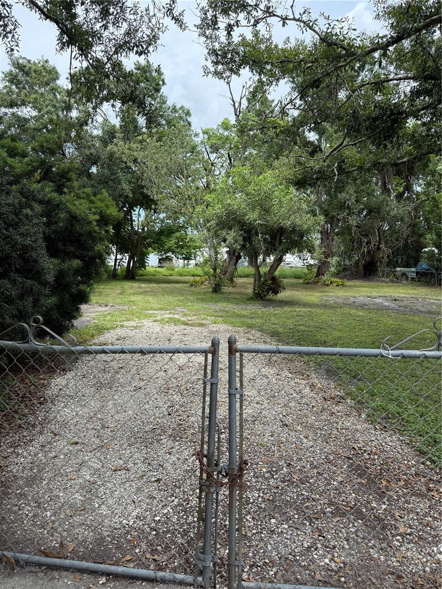 Nice cleared fenced buildable lot in East Palmetto. Close to grocery stores, hospitals, restaurants and gulf beaches.