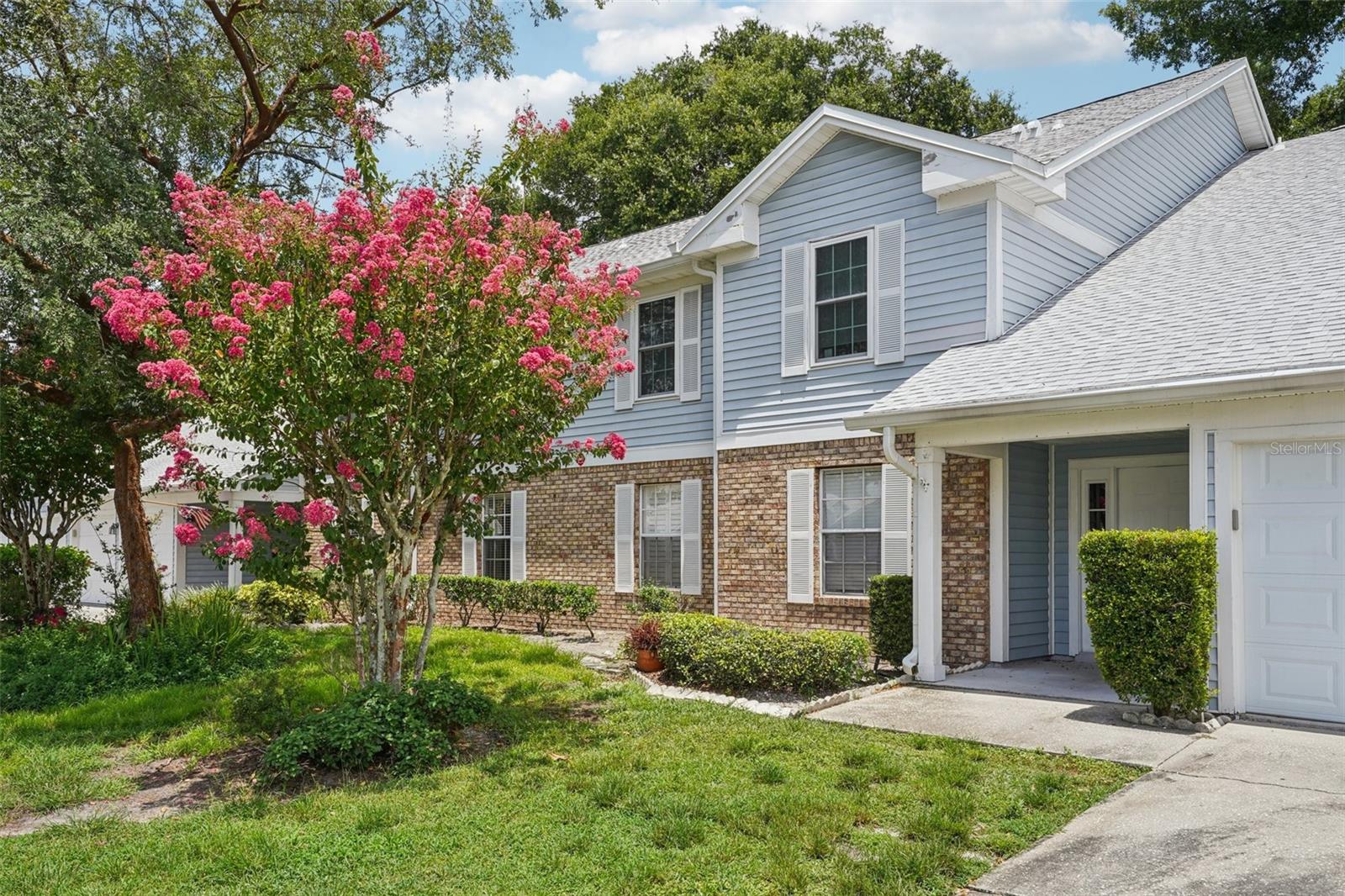 One or more photo(s) has been virtually staged. Seller may consider buyer concessions if made in an offer ~ This spacious second floor condo is truly MOVE-IN READY with all the big ticket updates already done – NEWER ROOF (2021), NEW A/C (2022), UPDATED PLUMBING (2022), NEW WATER HEATER (2022), and FRESH INTERIOR PAINT (July 2025)! All that’s left to do is bring your things and start enjoying the space! Inside you will be pleased to find a bright, OPEN LIVING SPACE with VAULTED CEILINGS, a cozy WOOD BURNING FIREPLACE, and PLANTATION SHUTTERS that add character and privacy. Through sliding glass doors off the living area, the SCREENED BALCONY offers peaceful green space views and your own quiet spot to relax and unwind. The kitchen has everything you need, including desirable STAINLESS STEEL APPLIANCES (2021), granite countertops, pantry storage, and a layout that is both functional and inviting. You will also appreciate the IN-UNIT LAUNDRY (WASHER AND DRYER REPLACED 2021) inside a large utility room – super convenient and a rare find in condos. You will have your own 1-CAR GARAGE for parking or extra storage, plus access to great community amenities like the POOL and TENNIS COURTS. Bonus – the HOA even includes internet! Located in the Coach Homes at Dover Village you are zoned for A-RATED SCHOOLS including Dover Shores Elementary and Boone High School, and just minutes from Curry Ford Rd, major roadways (551,15, 408), and Downtown Orlando – as well as all the shopping, dining, and parks you could want nearby. If you are looking for a stylish, LOW MAINTENANCE home that has been well cared for and smartly updated, look no further than Eastbourne Way. Clean and comfortable with charming touches – it just feels like home! Call today to schedule a tour!