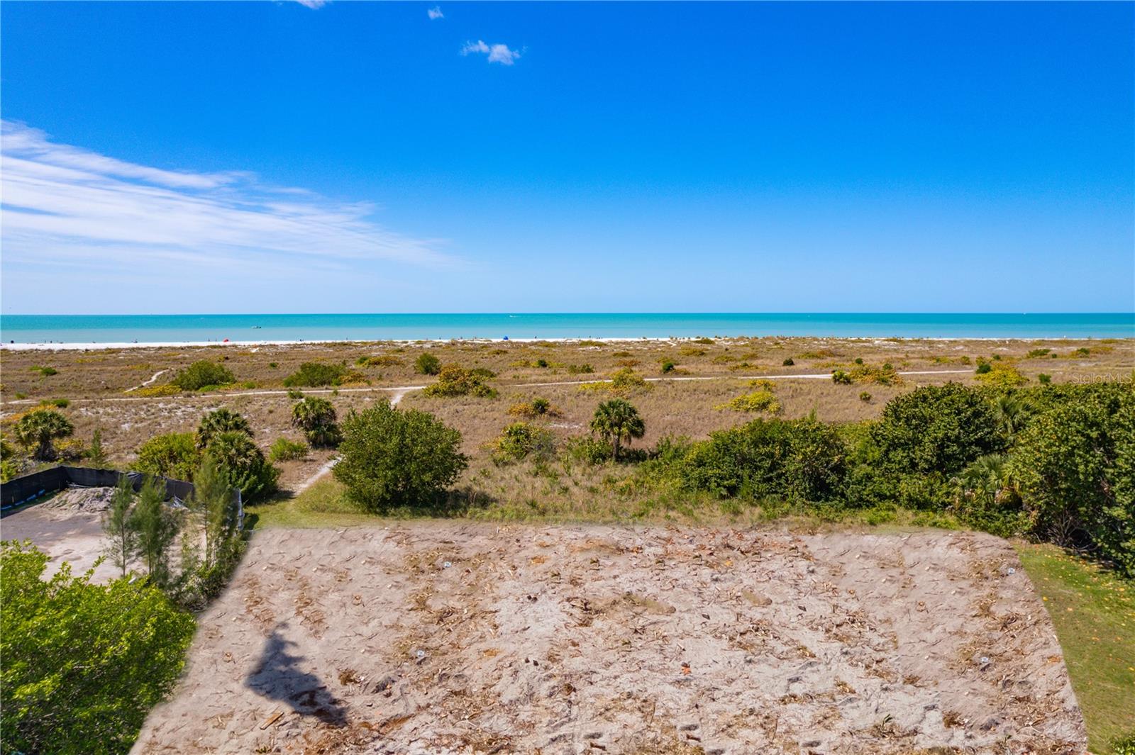 The last opportunity to own a direct Gulf-front estate size lot to build the home of your dreams on the spectacular Lido Key. State DEP permit in hand, design your own house plan or use our plans to build an amazing custom beach front oasis. Your new home on this expansive, 135' x 200' lot will have unobstructed views of the powdery, white sand beaches of the Gulf. Not only will you have remarkable privacy, with the lot being located at the end of a quiet drive where on-street parking is prohibited, but you also will be steps from that powdery sand and sparkling water of Lido Beach, the nature trails of Lido Key, and the world-class shopping and restaurants of St. Armands Circle. An ideal location to create your own beach front paradise.