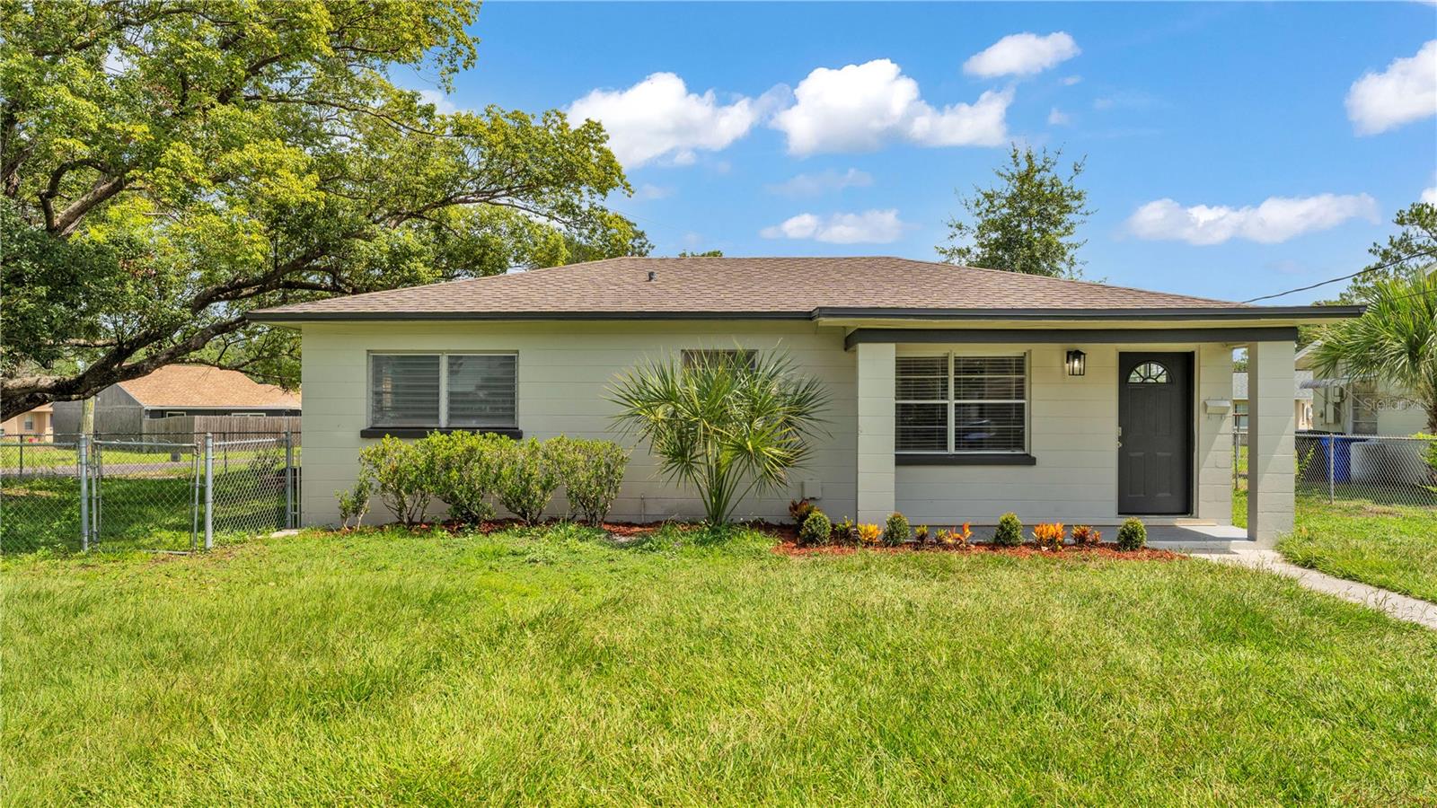 Welcome to this beautifully updated 3-bedroom, 1-bath home perfectly situated in a desirable and convenient location to all south Lakeland has to offer. Step inside to discover a bright living space featuring brand-new flooring throughout and fresh interior and exterior paint that gives the home a crisp and airy feel. The remodeled kitchen is a true highlight—boasting stainless steel appliances, updated cabinetry, stylish countertops and beautiful backsplash ideal for both everyday cooking and entertaining. The bathroom has also been tastefully renovated with new tile, vanity and light fixute. Enjoy year-round comfort with a newer A/C system, and take advantage of the large backyard—perfect for relaxing, gardening, or creating your own outdoor oasis. Whether you’re a first-time buyer, downsizing, or looking for a great investment opportunity, this move-in-ready home is a must-see!