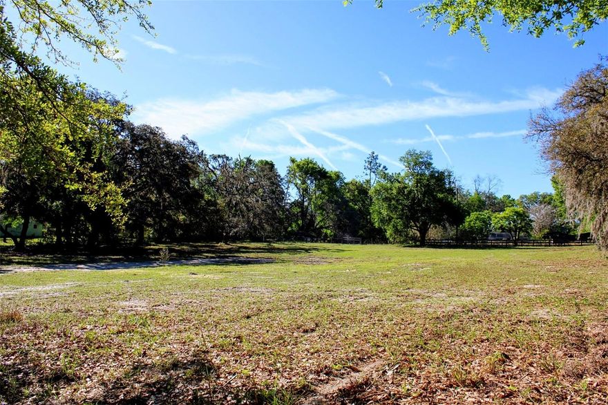 PRIME LOCATION! 2.4 acres nestled in the heart of the rolling hills in Dade City await your future dream home! This property is high and dry and allows plenty of room for animals, a barn,  pool, or a family compound!  The property features mature oak trees along the perimeter of the property providing maximum privacy but the property has been completely cleared down the middle, ready for your future home to be built! A brand new driveway/culvert has been installed, creating easy access directly from St. Joe Rd. but also features a secondary gated entrance at the back of the property. Almost fully fenced in, just needs a a front entrance gate!
The property can be divided into 2 parcels with a private entrance for each parcel already installed, and allows for one single family home to be built per acre (and animals if desired)!
Approximately 5 minutes to Historic Downtown Dade City where you can indulge in the small town charm with local culinary delights, breweries, shopping, parks, bike trails, drive in movies, festivals, Snowcat Ridge, and the new splash pad! Situated right near Happy Hill Rd. which provides easy access to I-75 only 5 miles away!  Approximately 20 minutes from Wesley Chapel where there is an abundance of shopping at 2 malls, endless dining options, hospitals, and the largest ice skating rink in the Southeast! Plenty of fun activities to do whether you immerse yourself locally in the small town living or drive a little further for larger amenities, you will remain tucked away in your own private country living to return home to.
Schedule a showing to view this gem today!