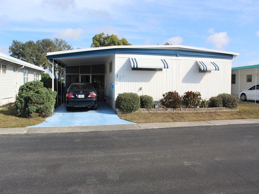 This attractive two-bedroom, two-bathroom mobile home offers a wide-open view of Palm Hill Country Club’s popular golf course and is conveniently located near the eighth tee. The owners have decided to sell their home, which comes completely furnished—including pots, pans, and dishes—ensuring a move-in ready experience. The very reasonable list price also includes a share in the community. Palm Hill is an active 55+ mobile home park where residents can take advantage of amenities such as pools, hot tubs, shuffleboard, tennis, pickleball, clubhouse dances, and much more. The monthly fee of $554 covers lot rent, water, sewer, trash, recycling, lawn care, and Spectrum fiber optic cable and internet. Upon entering from the screened room off the driveway, you step into a well-laid-out dining room that naturally flows into a spacious living room. Soft pastel-painted walls and windows on either side fill the space with natural light. The dining area offers generous storage and ample display space above. Adjacent, the galley kitchen is efficiently designed in front of the sit-down dining room, featuring appliances such as a range, range hood, counter microwave, dishwasher, and sink—all arranged for easy use. A sliding door off the living room leads to a large front bonus Florida room with windows that provide direct views of the golf course. This inviting space continues the soft pastel color palette and is perfect for entertaining friends. A door from the Florida room opens to a raised porch overlooking the course. Both bedrooms are situated at the opposite end of the home and are generously sized. The primary features a built-in cabinet with closets on either side and an additional storage cabinet. The guest bedroom is equipped with a large wall closet. The ensuite bathroom includes a sink, toilet, and shower, while the hall bath offers a tub with a shower attachment and a sink with plenty of counter space. Throughout the home, floors are laminate except for the bathrooms, which have linoleum. Ceiling fans are installed between the living and dining areas as well as in the front Florida room. Additional updates include a replaced and enlarged water heater in the hall bath and a new air conditioning unit installed in 2023.This mobile home enjoys a wonderful view of the golf course near the 8th tee and features a new roof-over completed in 2022-2023. Off the carport, there is a screened room with vinyl windows and a utility shed behind that has a newer washer. The property is reasonably priced and includes a share in the community, providing the buyers an opportunity to add their desired updates. For more information or to schedule a viewing, please call for a quick appointment.