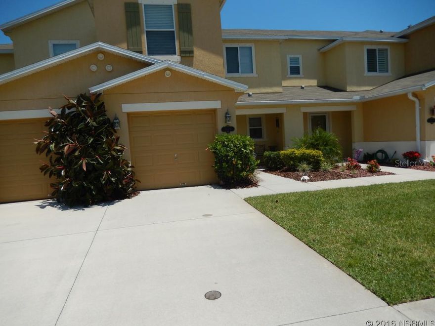 You will love this 2 Story Town Home in the beautiful Landings at Sugar Mill. This 3 Bedroom 2.5 Bath home with an over-sized 1 Car Garage will give you 1452 SQ FT of Living Space for the entire family to enjoy. Open Floor Plan with Laminate Flooring in main living area really sets the decor. Kitchen with Breakfast Bar is a Cooks Dream with the Stainless Double Oven and Cook top; Under cabinet lighting showing off all the counter space. Living/Dining Area for a Formal Affair or Causal Family gathering that flows out to your Lakefront Screened Lanai. Take the stairs up to the Owners Suite with a View of the Lake, Walk in Closet, Garden Tub and Shower. 2 Guest Beds with Guest Bath close by for your convenience.This town home is great for a first time home buyer, second home or a great investment income property. HOA Fees include the following: exterior maintenance, lawn care, termite bond and a community pool. Hurricane Shutters included in Home. All measurements are deemed to be accurate but cannot be guaranteed. Buyer is advised to verify. ;Water: City