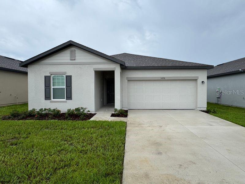 Beautiful new construction- never occupied. Welcome to this brand new dream home! This never lived in 4 bedrooms, 2 bath residence spans 1900 sq ft of stylish modern living. The open concept floor plan connects the great room and kitchen, perfect for hosting or simple enjoying family life. the chef inspired kitchen features stone countertops, abundant cabinetry, pantry storage and all major appliances included. A separate dining room offers space for both casual meals and special occasions. The huge primary suite is a true retreat with walk in shower and a huge walk in closet. With a split bedroom design, everyone enjoys their own private space. Step outside through sliding glass door to a covered lanai overlooking a private and serene backyard view- ideal for coffee or evening relaxation.. Plus enjoy the convenience of a two car garage, inside laundry room, all stainless steel kitchen appliances, washer, dryer and blinds. Perfectly located within 10 minutes drive to Hwy 27, shopping, restaurants, chain of lakes and Legoland Theme Park. Landlord request no pet.