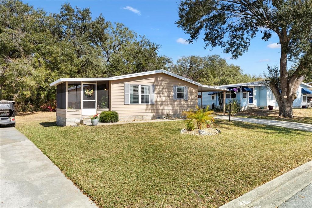 Photo of 520 Saint Andrews Boulevard, Lady Lake, FL 32159 (MLS # G5106104)