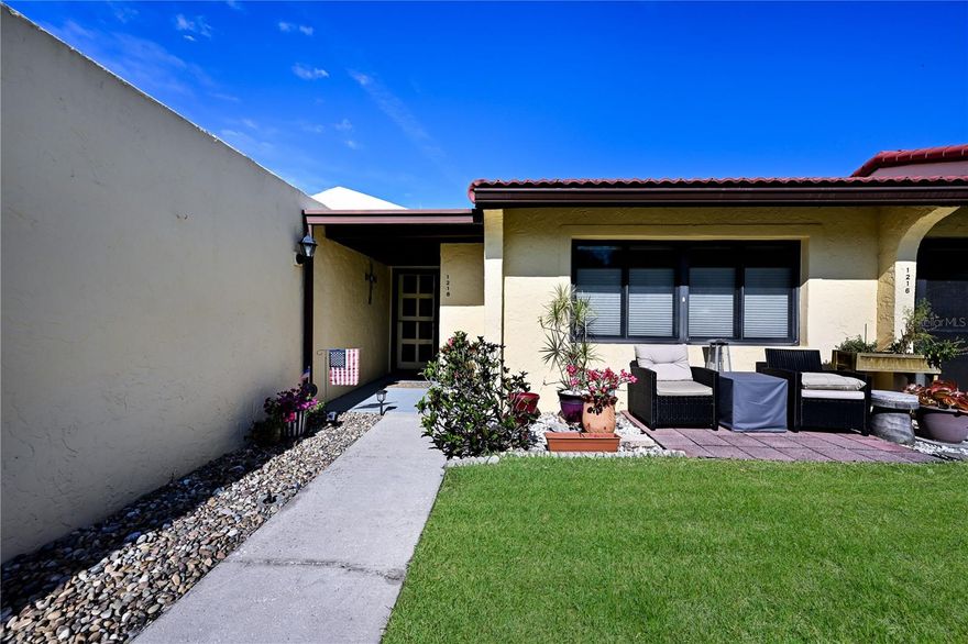 CAN YOU IMAGINE owning a home within six miles from the stunning beaches of Anna Maria Island? You’re never far from sun, sand and coastal charm! Discover effortless coastal living in the desirable Meadowcroft community! This charming one-bedroom, one-bath end-unit condominium offers 812 square feet of thoughtfully designed space that lives larger than expected, equally inviting for a seasonal escape or a permanent residence. Go inside to find a bright and inviting layout enhanced by high-impact windows throughout, providing peace of mind, energy efficiency and a significant value-add rarely found in the community. This charming and efficient floor plan maximizes every inch, creating a comfortable and functional living space that feels like home the moment you walk in. Enjoy a generously sized kitchen that makes meal prep a breeze, inviting you to cook comfortably and entertain with ease. The living area flows seamlessly onto a peaceful lanai, providing an ideal spot to unwind and enjoy your morning coffee or take in the Florida breeze. This additional outdoor living space extends your home, creating the ideal setting for quiet relaxation and casual gatherings. The home also features a fresh, renovated bath with modern finishes that add style and function. Positioned as an end unit adjacent to your covered parking area, this villa offers added privacy along with quick and convenient access to your reserved parking space, making daily living, grocery runs and guest visits effortless. Meadowcroft is a vibrant 55-plus community known for its active lifestyle and welcoming atmosphere. Residents enjoy a host of amenities, including a heated pool, clubhouse, pickleball, tennis courts, shuffleboard and a full calendar of social activities, making it easy to stay engaged and connected. Experience complete confidence with an HOA that includes cable, internet, water, sewer, trash, clubhouse access, resort-style amenities and complete exterior maintenance, including the roof. Oh, and did we mention you'll enjoy convenient access to our international airport, pristine beaches, nearby shopping, dining and everyday essentials, which makes this location as practical as it is desirable. Whether you’re looking for a seasonal retreat, desiring to downsize or searching for a strategic Florida investment, this condominium a gem offering exceptional value. Don’t miss your chance to claim your piece of paradise. Call today for your private showing.