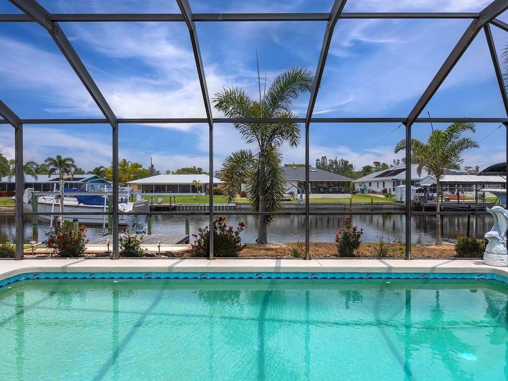 Photo of 18302 Burkholder Circle, Port Charlotte, FL 33948 (MLS # N6142090)