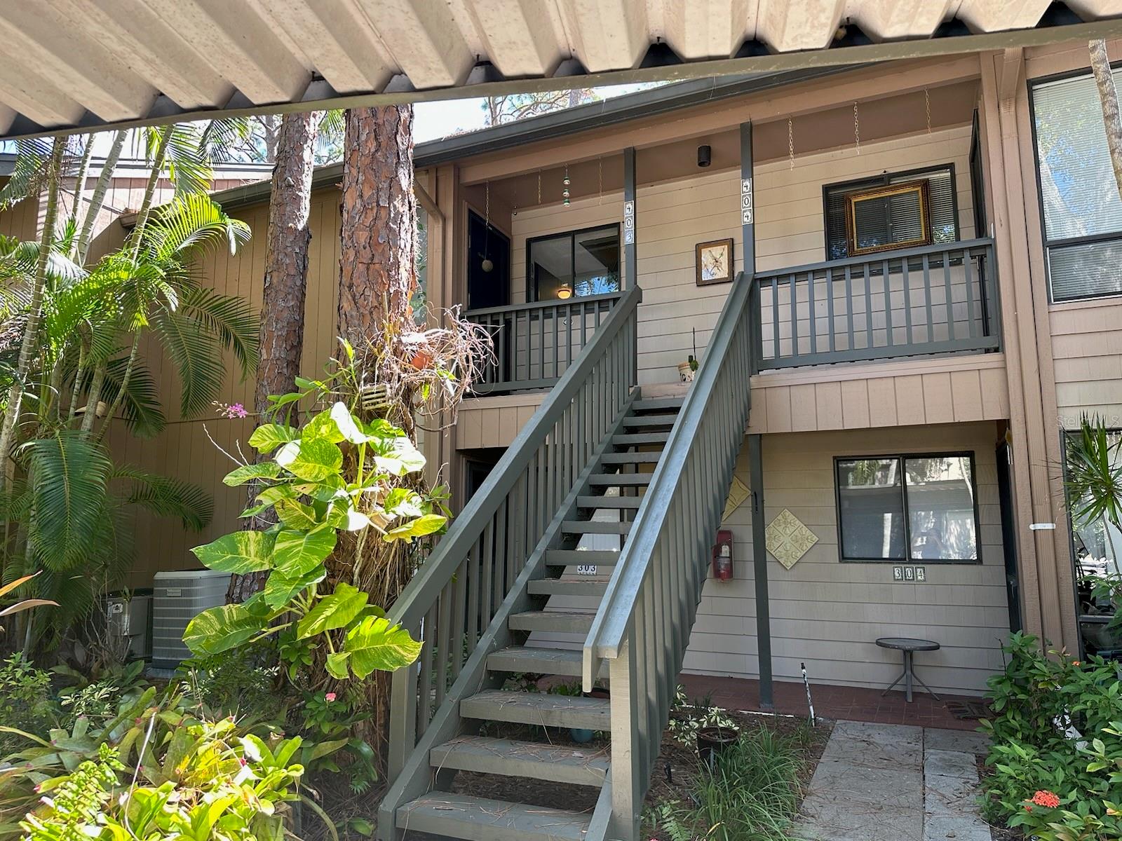 It is easy to enjoy the beauty of coastal waterfront living in Pelican Cove and this 2 bedroom/2 bath condo. The open floor plan with high ceilings and natural light/skylights creates a spacious and inviting atmosphere. The split floor plan includes a master bedroom with updated bathroom, walk-in closet and upstairs attic space. As you drive past the gate, the lush tropical setting, fruit trees, bird watching and manatee sightings in the harbor will offer instant serenity and relaxation. Amenities include art studio, woodworking shop, sculpting garden, 6 pools, yoga, tennis, pickleball, water aerobics, biking, new exercise room and kayak launches to name a few activities. Enjoy an impressive offering of performing arts, annual art show, cinema & culinary club, bridge and fiber arts club.