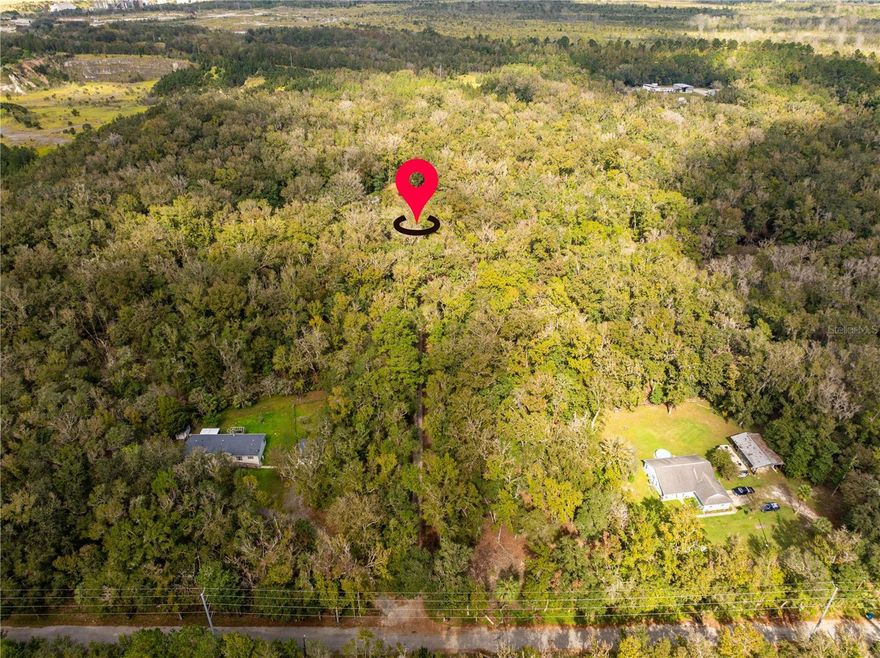 This 10-acre property in Brooksville offers a unique opportunity for those looking for privacy and potential. Accessed via a private easement, the land provides a serene, secluded setting, perfect for building your dream home or bringing in a new manufactured home. The property currently includes a manufactured home that is occupied but has no value, and a sturdy block two-car garage that could be repurposed for storage or workshop space. Additionally, the property is equipped with a well and septic system, offering convenience for future development. With plenty of room to spread out, the expansive acreage allows for potential agricultural use, outdoor activities, or simply enjoying the peace and tranquility of nature. Whether you're looking to create a custom home or place a new manufactured home, this property offers a blank canvas in a desirable area of Brooksville. Zoned agricultural, this land offers the flexibility to pursue farming, gardening, or other agricultural endeavors. Additionally, the property is not located in a flood zone, providing peace of mind for building and development.