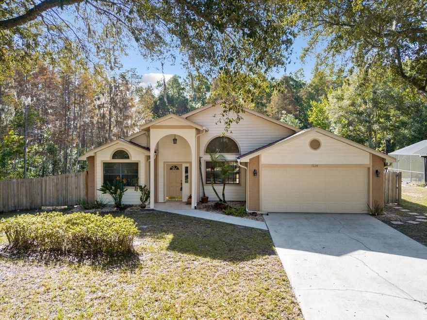 If you love nature, this is the home for you. Surrounded by lush nature and tucked into a quiet cul-de-sac.  This beautiful home features 3 bedrooms and 2 full baths. Designed as a split bedroom plan with the master on one side and 2 nice sized bedrooms on the opposite side of the home. Rest assured for any buyer as the Roof is BRAND NEW! OCTOBER 2023.  Freshly painted interior, New vinyl plank floors, new carpeting in all 3 beds.  Professionally cleaned. Driveway and walkway have been professional power washed.  Maintained landscaping. Vaulted ceilings. Enjoy the privacy of nature from your lanai overlooking a spacious partially fenced in yard.  Close to shopping and restaurants.  MOVE IN READY!