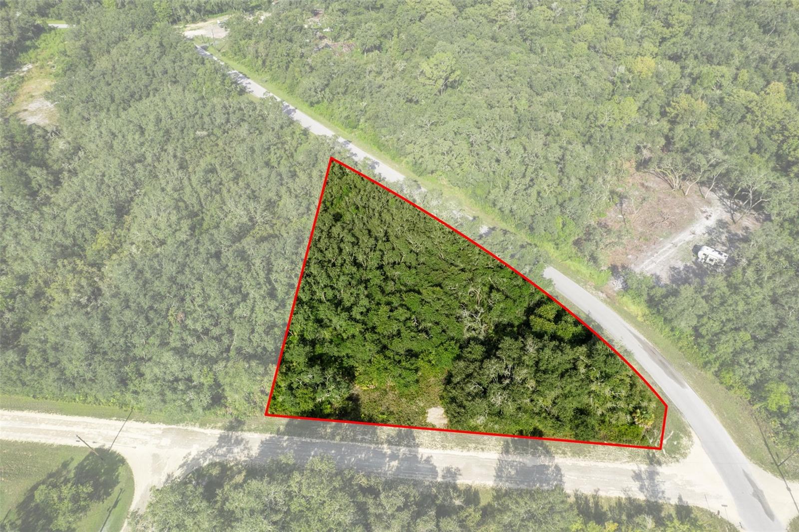 Embrace the opportunity to create your perfect home on this spacious .9-acre corner lot. Set along a paved road for easy access, this property offers a rare combination of privacy, convenience, and natural beauty. The wooded surroundings provide a peaceful retreat, while the corner location gives you more flexibility in your home’s placement and driveway access. With mature trees providing shade and natural beauty, you’ll enjoy a peaceful, tucked-away setting while still being close to everyday necessities. With plenty of room for a residence, garage, and outdoor living space, this lot is perfect for a site-built or modular home. Under current zoning, manufactured and mobile homes are not permitted.
The property is located at the south corner of Rousseau St and Bigelow. If you make a left onto Bigelow, the property will be the first property to the right.