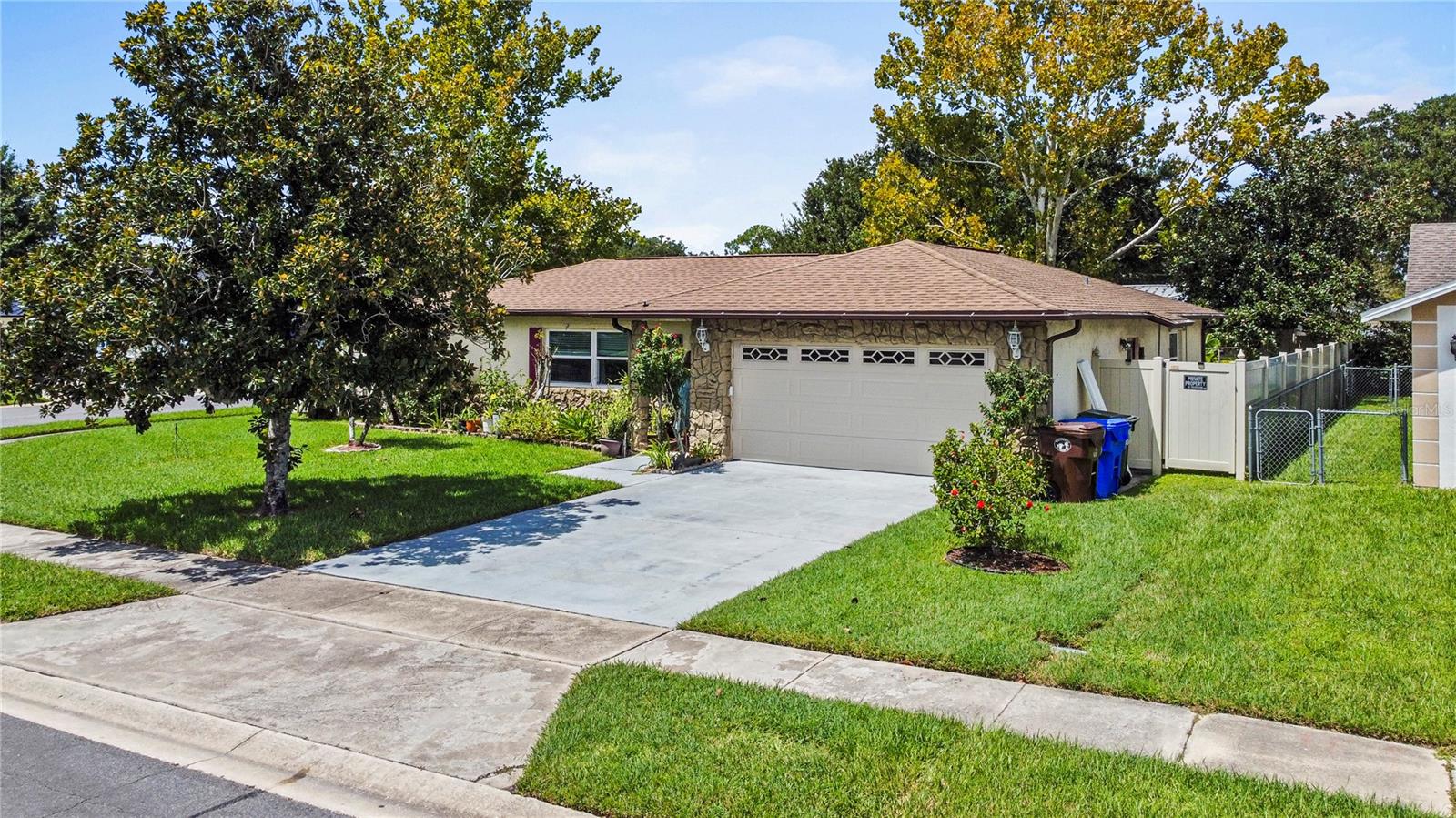 Renovated and Remodeled 2BR/2BA home on a Corner Lot with a Deluxe Primary Suite and upgrades throughout. The 500+ sq ft Suite features wall-to-wall closets, en-suite bathroom and flexible space for a lounging, office, fitness area or convert to an In-law suite…the possibilities are endless. Double bifold doors allow versatility by providing privacy or leaving it open and accessible. The RENOVATED KITCHEN offers LVP flooring, upgraded cabinets with undermount lighting, QUARTZ countertops, and stainless-steel appliances including a DOUBLE OVEN. Directly off the kitchen, a large Screened Lanai provides over 300 sq. ft. of extra living space with a little TLC. Additional highlights include CROWN MOLDING and TILE FLOORS throughout. Have peace of mind with major updates already completed: 2022-NEW AC, 2020-NEW HOT WATER HEATER. 2018 was a big year for upgrades including a NEW ROOF, 5 HIGH-IMPACT WINDOWS, NEW ELECTRICAL PANEL and a NEW GARAGE DOOR. The vinyl PVC FENCE with double gate was installed in 2016. Located in a highly sought-after Kissimmee neighborhood, convenient to Shopping, Restaurants, Schools, area attractions and major roadways. This move-in ready home offers style, comfort, and a distinctive design that sets it apart.