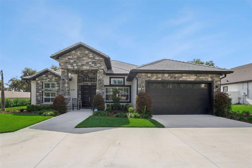 Welcome to this gorgeous pool home with NO HOA!! This 4 bedroom, 4 bathroom pool home offers 3,382 square feet of beautifully designed living space just moments from Lake Minnehaha and the charm of downtown Clermont. From the circular driveway and manicured front lawn to the covered front patio, every detail creates a warm and impressive welcome. Step inside to an open, light-filled layout where high ceilings, recessed lighting, and crown molding elevate every space. A private home office sits just off the entry, ideal for working from home, while two bedrooms with a convenient Jack-and-Jill bath are thoughtfully positioned on the opposite side. At the heart of the home, the expansive living, dining, and kitchen areas come together seamlessly, creating the perfect setting for entertaining or everyday living. The kitchen is truly a showpiece, featuring quartz countertops, a large island with waterfall edge, crown-molded cabinetry, premium LG stainless steel appliances, and generous prep space for gatherings of any size. Overlooking the living and dining areas, this layout ensures you never miss a moment with your loved ones. The living and dining areas are equally inviting, filled with natural light and accented by a stylish built-in mantle. The primary suite is a retreat all its own, complete with tray ceilings, a spacious walk-in closet with custom storage, and a luxurious en suite bath. The primary bathroom features a dual sink vanity, soaking tub, and walk-in shower with dual rain shower heads. This bathroom will feel like your own personal spa, making it the perfect place to unwind at the end of the day. Step outside and discover the true highlight of the home! The covered patio and screened lanai open to a resort-style saltwater pool and spa, complete with gas heating and space to comfortably accommodate guests. A fully equipped summer kitchen makes outdoor dining effortless, while a dedicated bathroom connects directly to the lanai and adds convenience when going for a swim. Whether you’re hosting weekend barbecues, relaxing in the spa, or enjoying quiet evenings under the stars, this space is designed to be enjoyed year-round. The fenced backyard provides plenty of room for four legged friends or little ones to play freely, all set on nearly half an acre for added privacy and flexibility. Additional upgrades, including a whole-house generator (2026), new gutters, a tankless water heater, and enhanced electrical features, provide both comfort and peace of mind to buyers knowing this home has been truly cared for. Conveniently located near major highways, top-rated schools, shopping, dining, and local parks, this home delivers the space, upgrades, and lifestyle you’ve been searching for, all with no HOA restrictions. Don't miss out on this stunning home in an ideal location, schedule your private showing TODAY!!