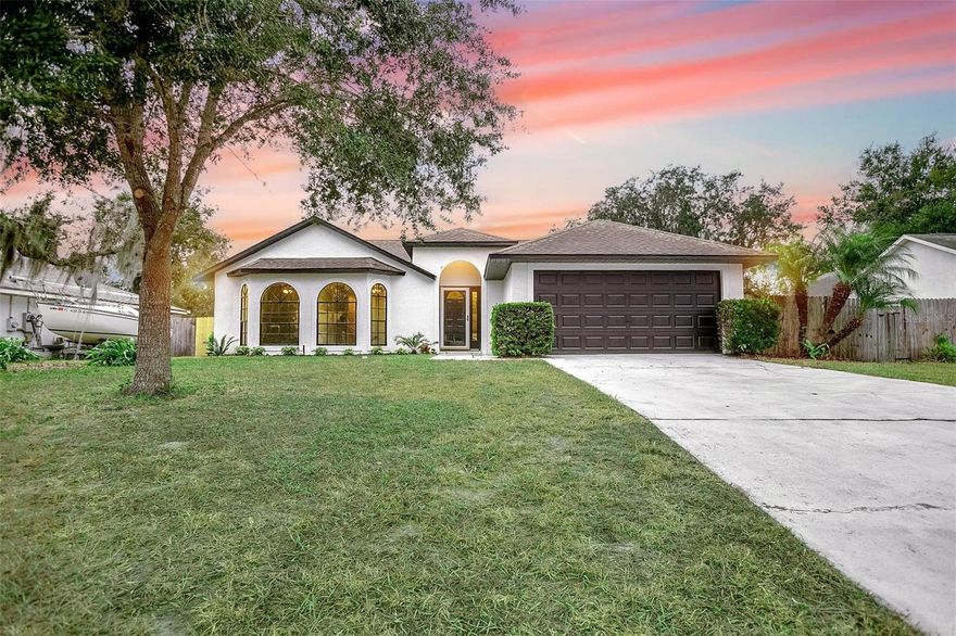 Welcome to your dream home! This stunning 3-bedroom, 2-bathroom haven is a perfect blend of comfort and style. Boasting a generous 1,567 square feet of meticulously designed living space, this residence offers a lifestyle of luxury and convenience. As you step inside, you'll be greeted by a freshly painted interior that exudes a sense of warmth and sophistication. The vaulted ceilings add an airy ambiance, creating a spacious and inviting atmosphere throughout the home. Brand new luxury vinyl plank flooring and crisp baseboards seamlessly flow from room to room, providing a modern and cohesive look. The heart of this home is the open kitchen, a chef's delight with granite countertops, stainless steel appliances, crown molding, and recessed lighting. Enjoy casual meals in the eating space within the kitchen or entertain guests in the adjacent dining area, creating the perfect setting for memorable gatherings. The master bedroom is a true retreat, featuring ample space and a tranquil ambiance. The attached bathroom suite is a spa-like oasis, complete with dual vanity sinks, granite countertops, a walk-in closet, and a large glass-enclosed shower. The additional bedrooms are bathed in natural light, with one boasting a generously sized walk-in closet, providing both comfort and functionality. Step outside to your private oasis – a rear screened-in porch overlooking a fully fenced backyard. Whether you're sipping your morning coffee or hosting a weekend barbecue, this outdoor space is perfect for enjoying Florida's beautiful weather. The indoor laundry adds an extra layer of convenience, making household chores a breeze. With a 2-car garage completing the package, this home is not just a residence; it's a lifestyle. Don't miss the opportunity to make this meticulously upgraded and thoughtfully designed property your own. Schedule a showing today and experience the epitome of modern living in every detail.