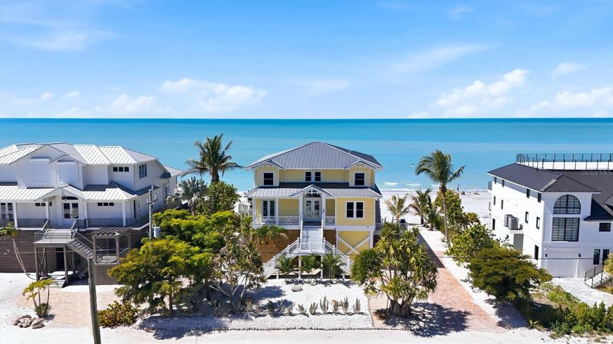 DIRECT BEACHFRONT LUXURY ON DON PEDRO ISLAND | OLD FLORIDA AT ITS FINEST

Escape to the unspoiled beauty of Don Pedro Island, where quiet shell-lined beaches, breathtaking sunsets, and sunshine-filled days define true coastal living. This exceptional 4-bedroom, all en-suite, 5-bath residence offers the perfect blend of luxury, comfort, and island charm in one of Florida’s most treasured hidden gems.

Designed to capture the essence of the coast, the home features an open, airy floor plan with a stunning wall of sliding glass doors that seamlessly connect indoor and outdoor living, leading to a spacious beachfront lanai where Gulf breezes and panoramic views take center stage.

The main living level is thoughtfully appointed for both everyday living and entertaining, showcasing a chef’s kitchen complete with a 6-burner gas cooktop, double ovens, warming drawer, wet bar, and an expansive island ideal for gathering. The inviting living room is enhanced by custom built-ins and a gas fireplace, creating a warm yet sophisticated coastal ambiance. A private office/den (optional 5th bedroom) and full bath complete the first floor.

Access all levels with ease via the 3-stop elevator, leading to the second floor where 3 of the 4 bedrooms open to a private upper lanai, offering sweeping Gulf views and tranquil retreats for guests and family alike.

On the ground level, you’ll find generous covered space and storage, perfect for entertaining, relaxing, or creating your own island-style outdoor living area.

Built for peace of mind, this home meets current hurricane codes and elevations and includes a generator backup, newer roof, and new irrigation system to maintain lush tropical landscaping.

Located on Palm & Don Pedro Islands, where there are no high-rises, no traffic, & no stress,  accessible via a 3+/- car ferry ride, this is one of the last places in the country where you can truly experience Old Florida living—just golf carts, sandy paths, and endless shoreline to explore.