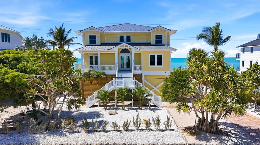 DIRECT BEACHFRONT LUXURY ON DON PEDRO ISLAND | OLD FLORIDA AT ITS FINEST

Escape to the unspoiled beauty of Don Pedro Island, where quiet shell-lined beaches, breathtaking sunsets, and sunshine-filled days define true coastal living. This exceptional 4-bedroom, all en-suite, 5-bath residence offers the perfect blend of luxury, comfort, and island charm in one of Florida’s most treasured hidden gems.

Designed to capture the essence of the coast, the home features an open, airy floor plan with a stunning wall of sliding glass doors that seamlessly connect indoor and outdoor living, leading to a spacious beachfront lanai where Gulf breezes and panoramic views take center stage.

The main living level is thoughtfully appointed for both everyday living and entertaining, showcasing a chef’s kitchen complete with a 6-burner gas cooktop, double ovens, warming drawer, wet bar, and an expansive island ideal for gathering. The inviting living room is enhanced by custom built-ins and a gas fireplace, creating a warm yet sophisticated coastal ambiance. A private office/den (optional 5th bedroom) and full bath complete the first floor.

Access all levels with ease via the 3-stop elevator, leading to the second floor where 3 of the 4 bedrooms open to a private upper lanai, offering sweeping Gulf views and tranquil retreats for guests and family alike.

On the ground level, you’ll find generous covered space and storage, perfect for entertaining, relaxing, or creating your own island-style outdoor living area.

Built for peace of mind, this home meets current hurricane codes and elevations and includes a generator backup, newer roof, and new irrigation system to maintain lush tropical landscaping.

Located on Palm & Don Pedro Islands, where there are no high-rises, no traffic, & no stress,  accessible via a 3+/- car ferry ride, this is one of the last places in the country where you can truly experience Old Florida living—just golf carts, sandy paths, and endless shoreline to explore.