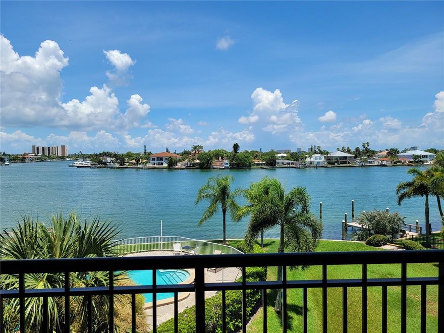 Prime Waterfront Value | Turnkey Income Producer Exceptional opportunity at The Palms of Treasure Island—one of the island’s most sought-after condo-hotels. No Minimum Stay Requirements!!  This beautifully updated 2-bedroom, 2-bath waterfront 950 sq./ft. unit offers wide-open Intracoastal views and a proven record as a high-income vacation rental with numerous repeat guests and consistent 5-star reviews. Thoughtfully remodeled throughout. Recent unit updates: hurricane impact sliding glass doors, furniture including mattresses for all beds and sofa, remodeled bathrooms, paint, ceiling fans, vinyl flooring, ceramic tile flooring in the kitchen and baths. A full function kitchen is equipped with a new microwave, refinished countertops, new sink, lighting and faucet. The convenience of a newer in-unit full-size washer and dryer. A huge 8’ x 18’ balcony showcases stunning waterfront views, perfect for relaxing, entertaining or dolphin watching! Full size Arcade machine with over 60 retro games is a huge hit for all family members. Enjoy resort-style amenities including a heated waterfront pool and spa, new dock, and under-building parking with plenty of guest spaces. Ideally located directly across the street from the Gulf of Mexico’s best beaches and just steps from shopping, dining, and entertainment. With strong occupancy, repeat bookings, and solid rental history, this is true turnkey waterfront income at its finest. Condo fees include cable TV, internet, water, trash, building insurance, and association reserves—making ownership simple and worry-free. Whether you’re expanding your investment portfolio or seeking a vacation home that pays for itself, The Palms of Treasure Island delivers the perfect blend of steady income and coastal luxury. Note: Year-to-date Payout from rental management company to owner is $49,707. The entire month of January 2026 is booked by a repeat vacationer with an income of $8,700.00.