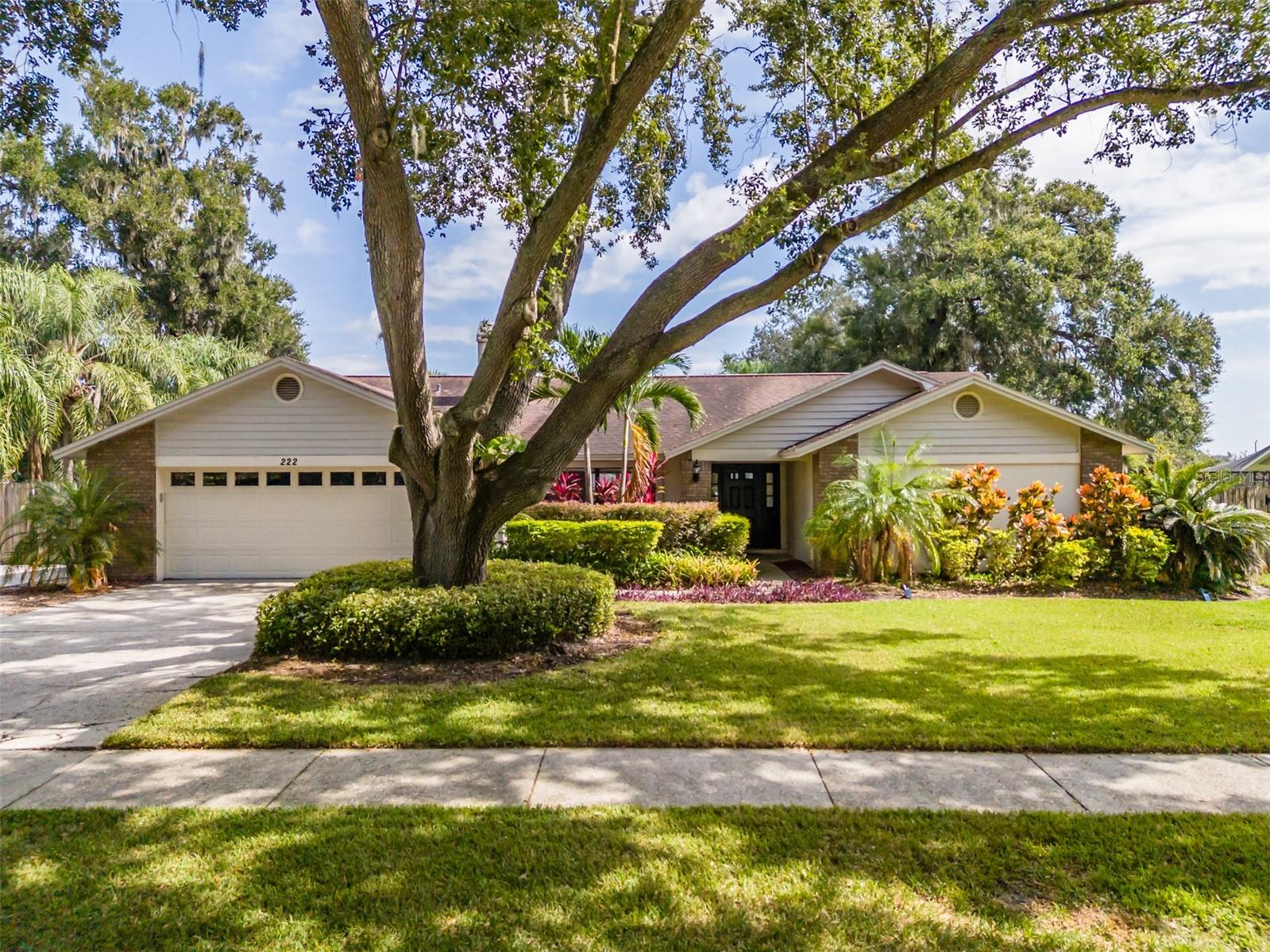 Pride of ownership shows in this stunning 4-bedroom, 2-bath pool home! The spacious kitchen is a chef’s delight, featuring stainless steel appliances—including a new dishwasher and microwave—granite countertops, abundant workspace, and a bar top perfect for casual dining. Glass sliders open to the screened lanai, ideal for indoor-outdoor living.
The inviting dining room boasts a cozy wood-burning fireplace and overlooks the beautifully landscaped front yard. The open and airy family room features vaulted ceilings, large windows, and additional sliders leading to the lanai, filling the space with natural light.
The primary suite offers a stylish shiplap accent wall and a walk-in California-style closet. The en-suite bath includes dual sinks and a large, glass-enclosed walk-in shower with a bench. The secondary bedrooms are generously sized, each with California-style closets—two include shiplap accents, and one opens directly to the lanai.
Additional features include an indoor laundry room with storage cabinets and durable waterproof wood laminate flooring throughout.
Enjoy Florida living at its best in your private, screen-enclosed lanai with brick pavers and a sparkling, resurfaced pool. The oversized, fenced backyard offers plenty of room for pets to play, plus a 2-year-old Tuff Shed for extra storage. The extended driveway and double gate provide RV or boat parking, complete with a 30-amp breaker.
Recent updates include: Pool resurfacing and brick pavers around pool and pathways, Pool filter, heater, and saltwater conversion
New dishwasher and microwave. Situated on a .34-acre lot with lush landscaping, this home offers great curb appeal and convenient access to I-4, I-75, and Hwy 301. Come see this beautiful, move-in ready home—perfect for entertaining and everyday comfort!