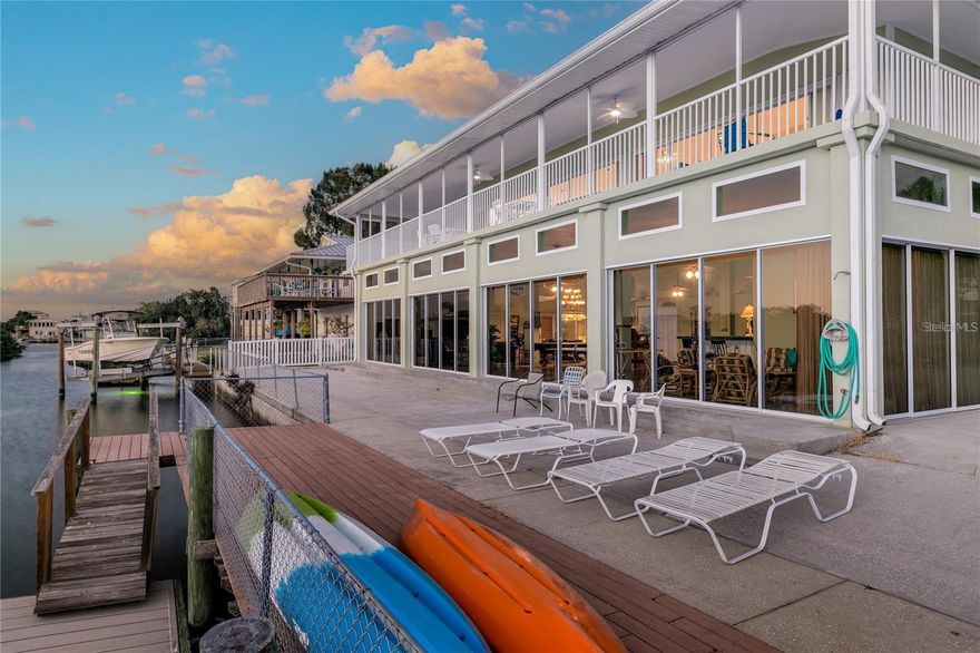 Location, Luxury, Waterfront Lifestyle!! Excellent family gathering oasis! Imagine waking up to dolphins playing in your back yard, an everyday paradise awaits you. Come experience waterfront living at its finest. Dock your boat and RV and enjoy the expansive outdoor spaces with endless opportunities for relaxation and recreation. Step inside this 3,888 sq ft home and be captivated by the breathtaking views. The entire downstairs has concrete polished floors and was created for entertainment. With expansive windows that invite in the natural light and showcase the shimmering waters, every moment feels like a postcard-worthy scene. Schedule your private showing today and unlock the door to a life of luxury, tranquility, and endless possibilities. **All information to be verified