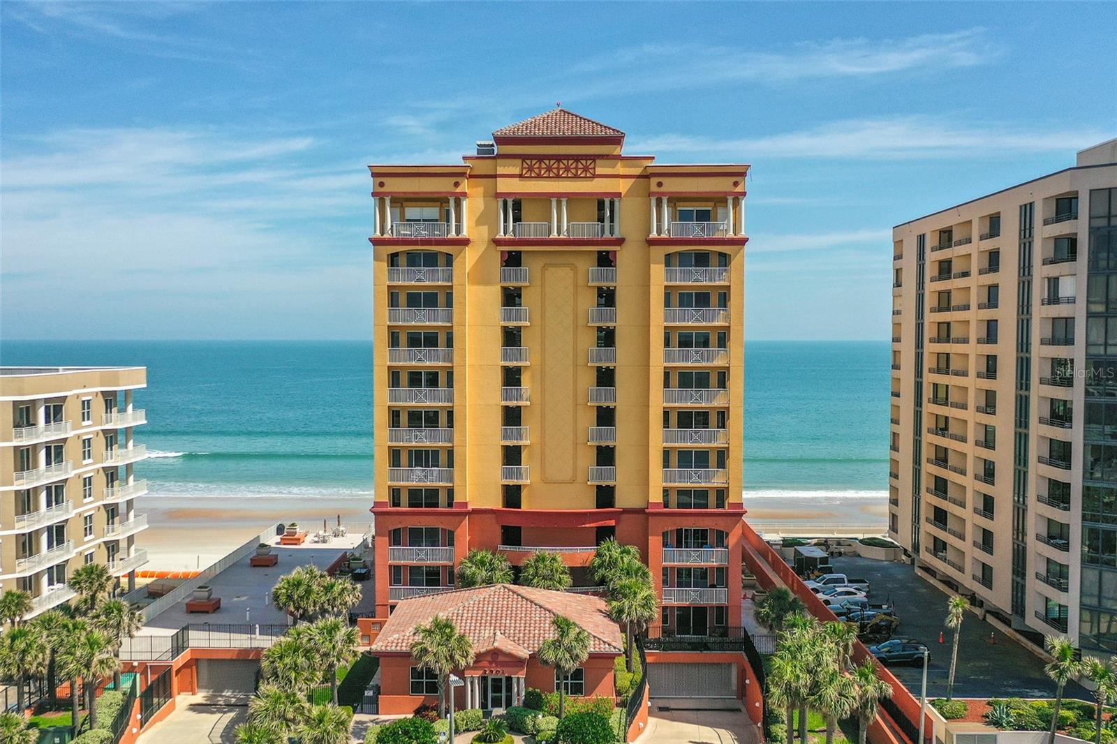 ULTRA LUXURIOUS DIRECT OCEANFRONT CONDO LOCATED ON A PRISTINE AND UNCROWDED AREA OF DAYTONA BEACH SHORES, THE SOUTHERN TIP OF ''THE GOLDEN STRAND'' THE MOST POPULAR UPGRADE OF ALL IS INCLUDED HERE: 2 COVERED, GATED, PREMIUM PARKING SPACES. A SANCTUARY OF LUXURY LIVING THROUGH PROFESSIONAL DESIGN! FINISHED IN A NATURAL, MUTED COLOR PALETTE, TO CREATE A CALM, SERENE AND INVITING AMBIANCE THAT LETS THE SHIMMERING BLUE OCEAN SHINE THROUGHOUT! COMBINED WITH 12X24 PORCELAIN FLOORING THAT WILL STAND THE TEST OF TIME, DRAWING FROM THE INSPIRATION OF NATURE AND THE STACKED STONE MEDIA WALL INCORPORATES THE TEXTURES FROM THE COAST. 42' OF ATLANTIC OCEAN FRONTAGE HERALDS STUNNING VIEWS AND A LUXURIOUS 3 BEDROOM CONDOMINIUM HOME. LEVEL 3+ GRANITE, KNOWN FOR ITS DURABILITY & LONG TERM INVESTMENT, WAS THE CHOICE THE DECORATOR CHOSE TO CASCADE THROUGH THE CHEF INSPIRED KITCHEN, THE HEART OF THE HOME. ADDITIONALLY THE KITCHEN FEATURES DOUBLE OVENS, A GLASS COOKTOP AND A WALK-IN PANTRY OFFERING SUPREME
STORAGE SOLUTIONS.
ELEGANT SMOOTH CEILINGS RISING 9 FEET HIGHLIGHT THE SPACIOUS, OPEN-FLOOR PLAN. THE OCEANFRONT PRIMARY SUITE AND THE GREAT ROOM BOTH OPEN ONTO AN EXCEPTIONALLY PRIVATE OCEANFRONT BALCONY.
THE OCEANFRONT POOL & SPA & EXTRAORDINARY TILED SUNDECK ARE PROTECTED BY A SUBSTANTIAL SEAWALL THAT MAKES TUSCANY SHORES AN ICON.
THERE IS NO BETTER LOCATION ACROSS FROM THE GOLF & RACQUET CLUBS, SHOPPING AND DINING PLEASURES. PROFESSIONALLY MANAGED WITH AN OWNER'S CLUBROOM AND LOUNGE, A FITNESS CENTER AND THE MOST PRIVATE OCEANFRONT LIFESTYLE IN A MAINTENANCE-FREE ENVIRONMENT. SIRS REPORT HAS BEEN COMPLETED.