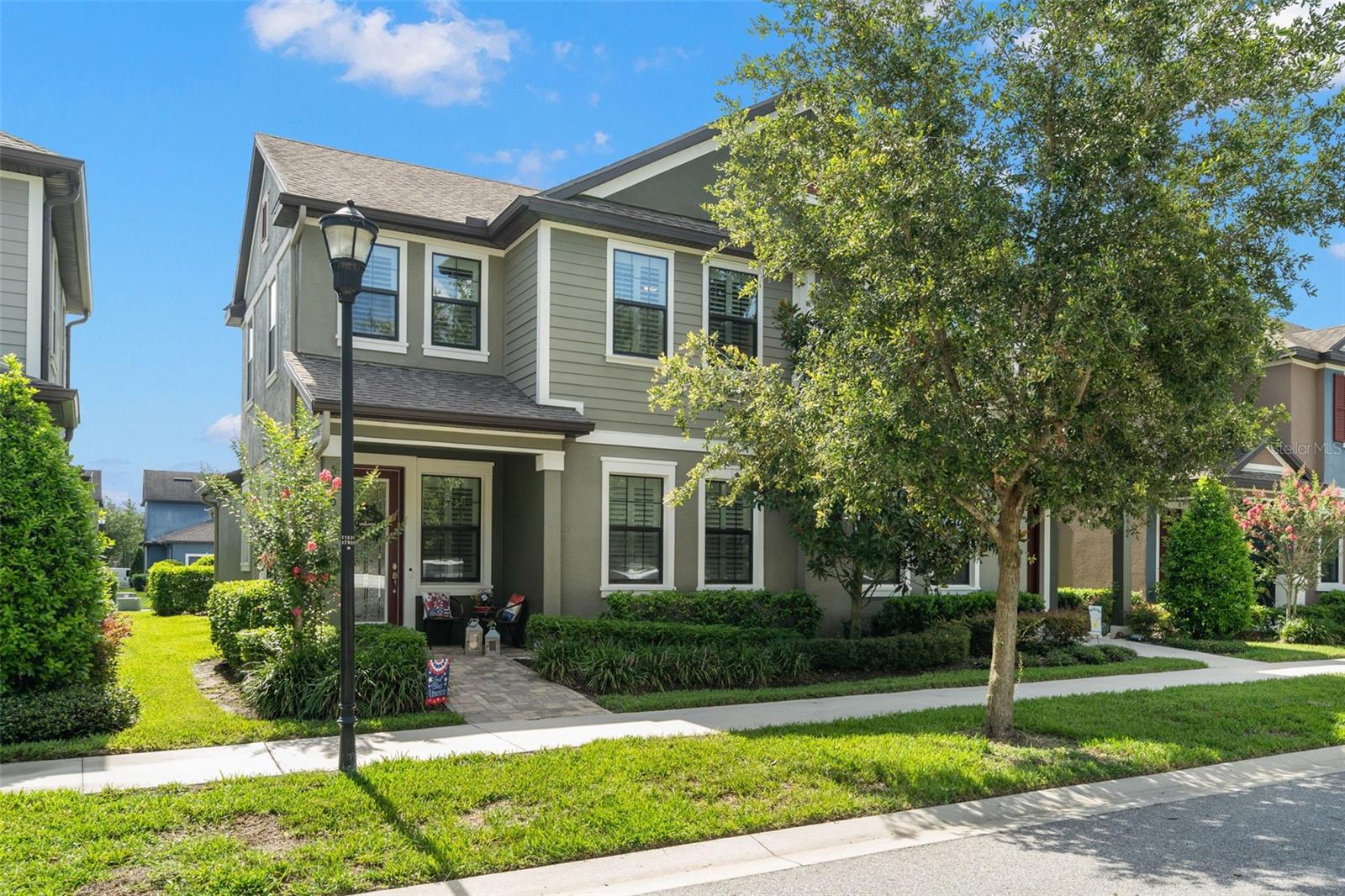 Welcome home to your well maintained and appointed, beautiful, like-new paired villa in Fishhawk Ranch West where your landscaping is included in the monthly HOA. This townhome feels more like a single-family home with 3 bedrooms, 2.5 bathrooms and a loft with a breezeway covered patio to your 2-car garage. As you walk up the brick paved entryway, you are greeted with a decorative glass front door. Inside you will find wood-look tile flooring, a spacious open-concept living room/ dining room/ kitchen combination, main floor laundry and a powder room. Sturdy wood shelving and hangup bar have been added to the laundry closet making organization and function a breeze. The kitchen is well appointed with 42" cabinetry, granite countertops, stainless steel appliances and ample cabinet and pantry space. The primary bedroom is located on the first floor with an en-suite bathroom and large walk-in closet with custom closet system. Step outside to your breezeway patio before entering your rear-facing garage with an extended driveway. There are 5 suspended storage racks in the garage to meet all of your storage needs. Back inside, the carpeted stairs lead you up to a loft area, 2 bedrooms and a full bathroom. This home boasts plenty of upgrades throughout including a brick-paved entrance and patio, upgraded light fixtures, upgraded shower tile in full bathrooms, gutters, Blink doorbell and cameras, and PVC plantation shutters on every window. Discover the Fishhawk Ranch lifestyle with a community pool, Lakehouse, fitness center, playground, dog park, basketball court, walking trails and community events. Call to schedule your tour of this stunning home and community today!