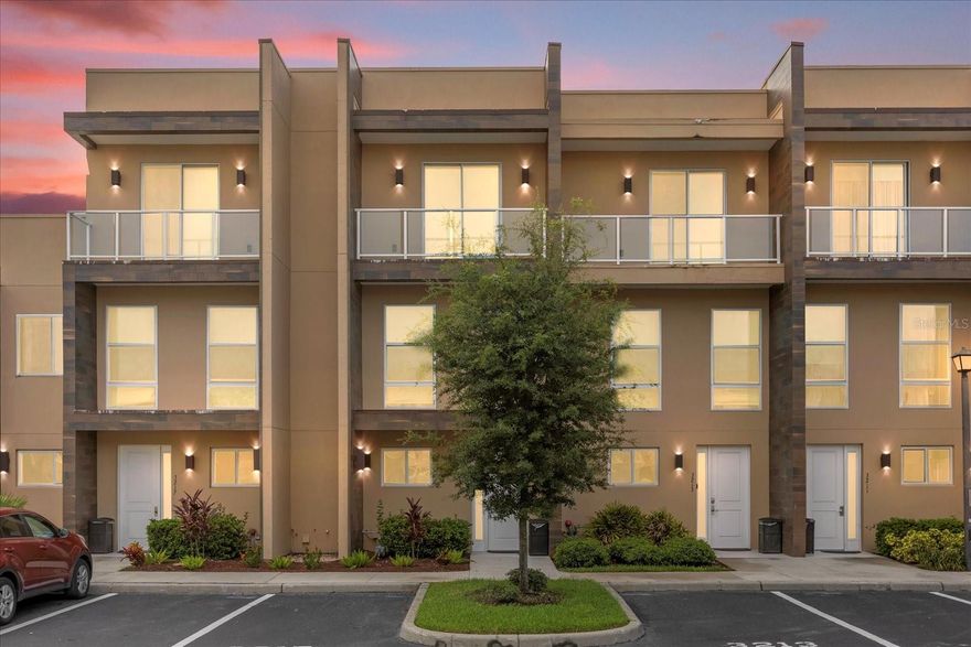 Unlock effortless vacation living—just minutes from Walt Disney World®!
This fully furnished 3-bedroom, 3.5-bath townhome delivers the perfect blend of style, comfort, and investment potential. Located in the sought-after, gated Magic Village community, this contemporary retreat offers resort amenities, the freedom for short-term rentals, and the option to self-manage for maximum returns.

Step inside and experience a bright, open-concept layout elevated by sleek finishes and soaring two-story ceilings. The kitchen features stainless-steel appliances, a five-burner gas range, generous cabinetry, and an oversized breakfast bar—flowing seamlessly into the spacious great room. Floor-to-ceiling windows bathe the home in natural light, while sliding glass doors open to a covered lanai with a built-in summer kitchen. With no rear neighbors, it’s the perfect spot for morning coffee, sunset cocktails, or relaxed outdoor dining.

A private elevator adds convenience, making every level of this townhome easily accessible.

Upstairs, the primary suite feels like a boutique hotel, complete with a custom walk-in closet and spa-inspired bath with floating dual vanities and a frameless glass shower. The second suite features its own balcony and private bath, and the third bedroom also includes an en-suite bath and walk-in closet. A main-level laundry room and powder bath keep daily living and entertaining simple.

Magic Village amenities include:
• Resort-style pool
• Clubhouse with restaurant and bar
• State-of-the-art fitness center
• Multilingual front-desk services
• Daily curbside trash pickup
• Housekeeping and maintenance options
• Complimentary Wi-Fi
• Ample guest parking
• Secure, gated entry

All of this—and only minutes to Walt Disney World®, premium shopping, great dining, and major roadways (US-192, SR-429, I-4).

Whether you're seeking a personal vacation retreat or a revenue-producing investment, this turnkey townhome is ready to impress. Schedule your private showing today and step into the Magic Village lifestyle.