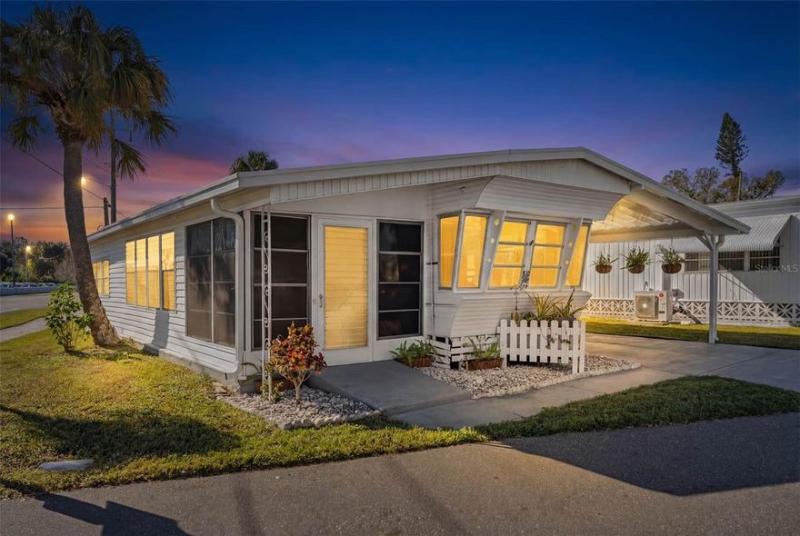 Welcome to DeSoto Place – a land-owned 55+ community in the heart of Sarasota. This beautifully preserved and thoughtfully updated 1958 vintage mobile home offers a rare blend of character, comfort, and convenience. Situated on a large lot with approved plans for a hedge between the home and the road, the setting provides both space and future privacy options.

Inside, you’ll find a warm and welcoming 2-bedroom, 1-bath layout with updated plumbing and flooring, an inside laundry, and a cozy, comfortable feel that makes this home easy to love. The enclosed lanai adds valuable living space, perfect for relaxing or entertaining year-round.

Outside features are equally impressive, including a carport accommodating up to three vehicles, a shed with electric, and hanging ferns along the carport supported by irrigation, adding charm and curb appeal. The home has been well cared for, maintaining its vintage integrity while offering modern comforts.

Located just minutes from Sarasota-Bradenton International Airport, shopping, dining, and medical facilities, this home is ideally positioned for both seasonal and full-time living. DeSoto Place residents enjoy access to a clubhouse, swimming pool, shuffleboard courts, and an active community atmosphere.

A truly special opportunity to own a land-owned, vintage gem in a desirable Sarasota location—comfortable, unique, and full of character.