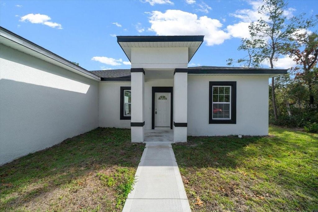 Photo of 6895 SW 130th Lane Road, Ocala, FL 34473 (MLS # OM716391)