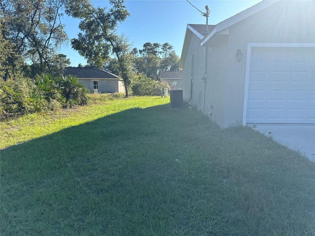Photo of 18 Malauka Radial Terrace, Ocklawaha, FL 32179 (MLS # O6362455)