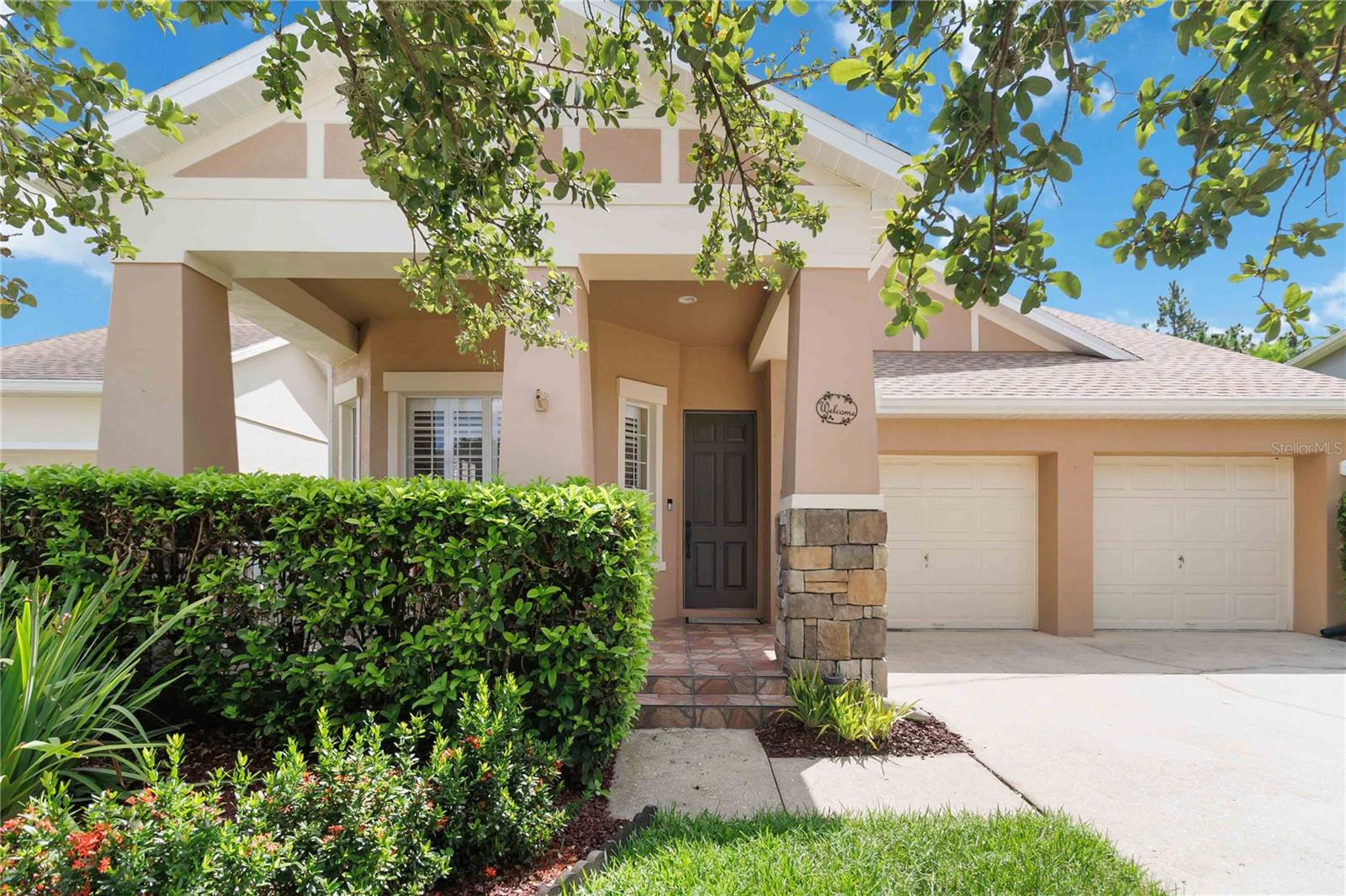 Welcome to this beautifully maintained one-story home in the heart of Avalon Park, offering the perfect blend of style, comfort, and modern updates. With 3 bedrooms, 2 full bathrooms, and 1,903 square feet of living space, this move-in-ready gem has it all. Step inside to find wood-look luxury vinyl plank flooring throughout the main living areas—stylish, durable, and easy to maintain—while all three bedrooms feature plush carpeting for added warmth and comfort. The spacious layout includes an open living and dining area, ideal for entertaining, and a thoughtfully updated custom primary suite featuring a gorgeous remodeled bathroom with elegant finishes and stone-pattern tile. Two additional bedrooms share a well-appointed hall bath, offering space and flexibility for family or guests. Enjoy the outdoors year-round from your screened-in lanai, perfect for relaxing or dining al fresco. This home also features a brand-new roof, offering long-term peace of mind. Located in the vibrant and walkable Avalon Park community, you’ll enjoy access to top-rated schools, scenic parks, community pools, dining, shopping, and year-round events—all just minutes from your front door.
