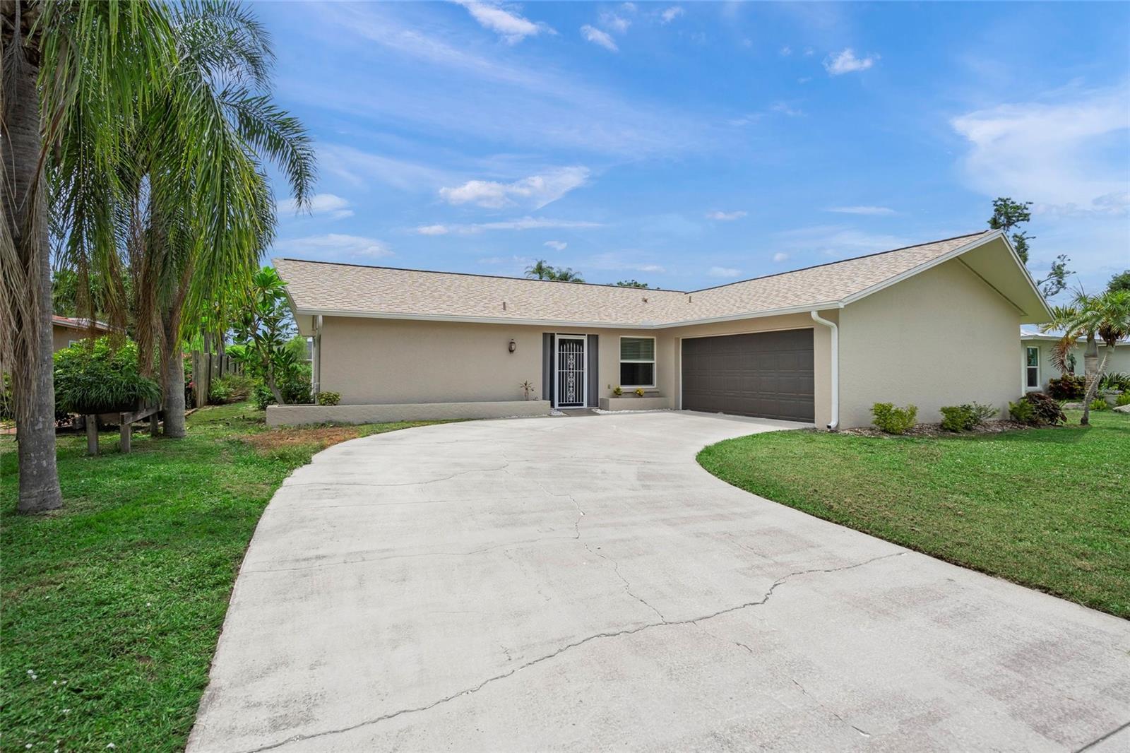 Four bedrooms. A private pool. New Roof. Direct access to the Legacy Trail. And under $450,000. This is the opportunity value-driven buyers have been waiting for. Whether you're a growing family, remote professional, retiree, or multi-gen household, this rare find offers the space, flexibility, and lifestyle that’s nearly impossible to duplicate in today’s Sarasota market. The true 4-bedroom layout provides room to grow, work from home, host guests, or live together with ease. Multiple living areas and a separate dining space flow naturally to the covered lanai and screened pool—perfect for year-round enjoyment. Tucked on an oversized lot with no rear neighbors, this home backs directly to the Legacy Trail—one of Florida’s most celebrated walking and biking paths. Build your own gate and access the trail from your backyard, or fence it up for privacy—it’s your lifestyle, your choice. Located in Tamaron, a centrally located community with sidewalks, ponds, and a 13-acre nature preserve just a short walk away, featuring peaceful walking trails, pond views, picnic spots, and wildlife watching. All with low annual dues and a reputation for pride of ownership. Just 15 minutes to Siesta Key and 10 to downtown Sarasota, this home checks all the boxes for location, livability, and long-term value. Don’t miss your chance—4-bedroom pool homes like this in the heart of town under $450K are almost unheard of.