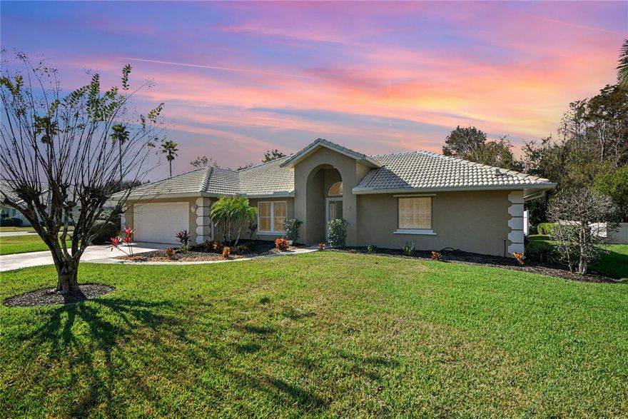 One or more photo(s) has been virtually staged. - Furnishings only. On a desirable corner lot overlooking a tranquil pond in the Lakes of Spruce Creek Fly-In, this former three-bedroom, three-bath model home has been lovingly maintained and thoughtfully remodeled. The updated quartz and stainless steel kitchen serves as the home's entertaining centerpiece, flowing seamlessly into the family room and onward to the enclosed Florida room, ideal for indoor-outdoor living while enjoying peaceful water views. The primary suite is highlighted by a beautifully renovated primary bath featuring abundant natural light, dual vanities with a center cabinet and a spacious walk-in shower. Additional interior features include plantation shutters throughout and impact windows installed in 2014 and 2016. Recent improvements include a 2019 air-conditioning system, a 2025 water heater, electric hookup for a generator, a termite bond and a tile roof with an estimated 10 years of remaining useful life. Spruce Creek Fly-In is a desirable guard-gated community offering a unique lifestyle with a private airport and runway, on-site restaurant, country club experience, golf, tennis, pickleball, fitness center, and 24-hour security providing residents with luxury and convenience in a one-of-a-kind setting.