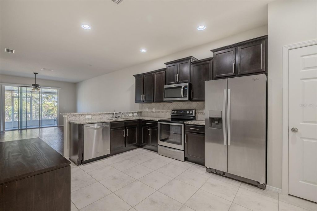 Photo of 4734 White Sanderling Ct, Tampa, FL 33619 (MLS # TB8469745)