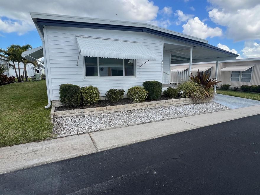 It’s here! A brand-new opportunity for you to find your forever home in this newly available two-bedroom, two-bathroom residence offering approximately 1,100 square feet of living space in the friendly, activity-rich 55+ community of Palm Hill Country Club. This dynamic neighborhood features an impressive collection of amenities, including a nine-hole golf course, clubhouses, three swimming pools, two jacuzzis, tennis courts, shuffleboard, billiards, a horseshoe pit, and a pickleball court. Whether you prefer a full calendar of activities or quiet afternoons soaking up the Florida sunshine, your days can easily be tailored to suit your pace and interests. Adding to the appeal, the once-monthly maintenance fee of $554.00 simplifies ownership by covering water, sewer, garbage, lawn care, cable, and internet, creating a streamlined lifestyle where services are handled with ease.INTERIOR:Upon entering this beautiful residence, you’ll find a well-designed layout suited to modern living, presenting a move-in-ready environment that is nicely furnished and enhanced by tasteful décor (a few select pieces may be removed by the owner). Vinyl plank flooring rests over sturdy plywood subfloors, while updated windows and doors allow natural light to flow through the living spaces. Central heat and air installed in 2022, along with stylish ceiling fans and overhead ductwork, help maintain a comfortable indoor climate. The newly renovated kitchen serves as a highlight of the home, showcasing quartz countertops, a decorative backsplash, and a full appliance package including a refrigerator, range, oven, dishwasher, disposal, microwave, and ice maker. A functional island offers additional surface area for meal preparation while also creating a natural gathering spot. Just beyond, the generous dining room features a buffet with wine storage and lower cabinetry designed to accommodate dishes and linens, making entertaining both easy and organized. From there, the space flows seamlessly into the inviting living room, providing a welcoming setting for conversation, relaxation, or hosting guests. The guest bedroom presents a peaceful retreat for visitors, complete with a closet for convenient unpacking and nearby access to the guest bathroom. This bathroom features a new vanity with abundant storage, decorative lighting, and a tub-and-shower combination. The primary bedroom is impressively sized and offers two walk-in closets that provide substantial wardrobe capacity. Its en suite bathroom completes the private retreat with a new vanity and a renovated walk-in shower, creating a comfortable and functional design. EXTERIOR:At first sight, this home captures attention with its appealing exterior and neatly maintained landscaping. Light-colored vinyl siding gives the residence a bright, welcoming look, while a lowered screened room showcases tiled flooring that enhances the space—ideal for enjoying the Florida indoor/outdoor lifestyle. The front porch features the same tile underfoot, creating a cohesive transition that adds to the overall curb presence. An extensive shed houses a new washer and dryer and provides handy storage for yard tools and other items.  Priced at $129,900 and including the share, this home also features a one-car carport, a roof-over installed in 2012, and updated vapor barrier and tie-downs.