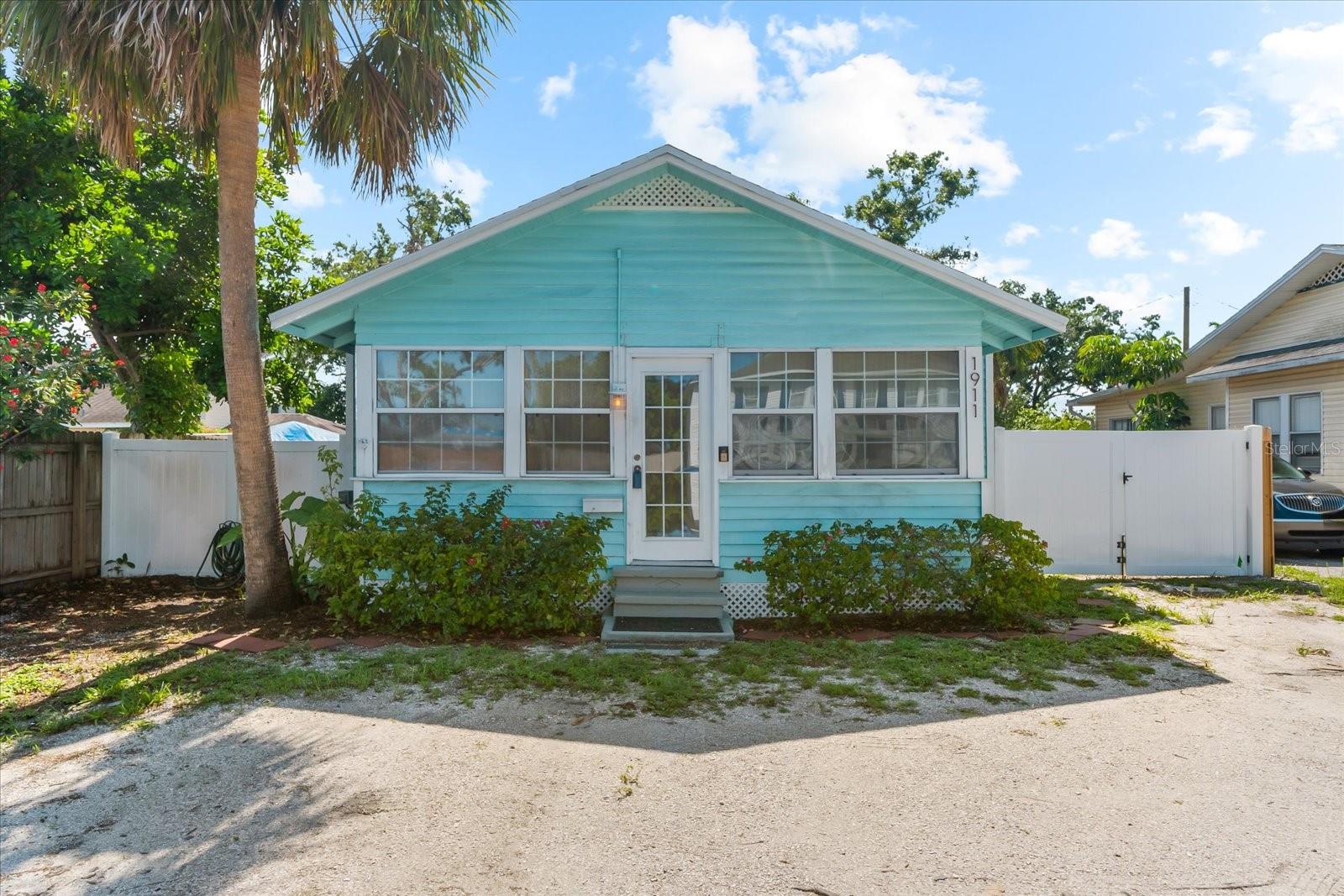 Welcome Home! This absolutely adorable historic 2-bedroom, 1-bath cottage is full of character and ideally located just minutes from Downtown Bradenton. Brimming with charm, the home features original hardwood floors, soaring 9-foot ceilings, and two porches—perfect for enjoying your morning coffee or relaxing in the evening.
Updates include a new roof (2018) and new AC (2018), offering peace of mind and modern comfort. Additionally, recent electrical upgrades include a 240V outlet, ideal for EV charging. The fully fenced yard provides privacy and space, complete with a back deck for entertaining and a convenient storage shed.
All this just a short drive to the gorgeous beaches of Anna Maria Island, as well as local shopping, restaurants, and vibrant downtown life. This delightful home is the perfect blend of historic charm and modern convenience—don't miss your chance to make it yours!