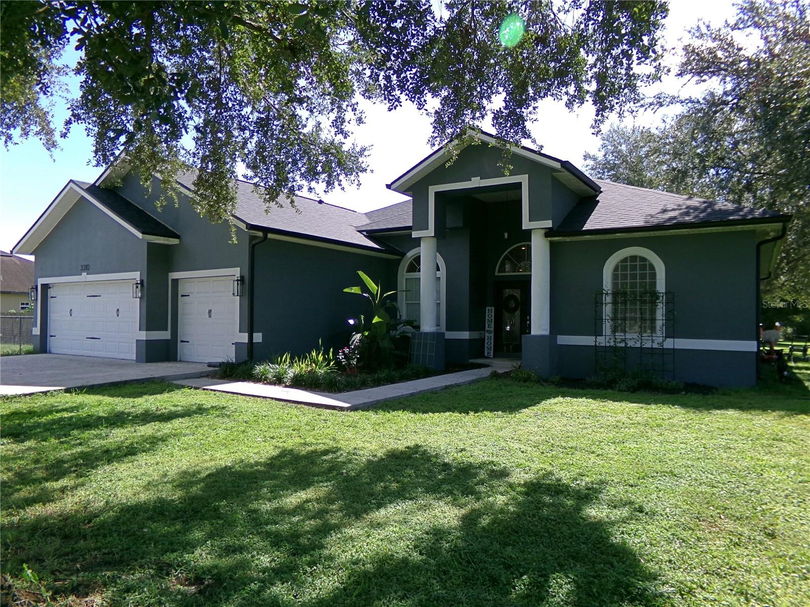Wonderful and spacious 4-bedroom, 3-bathroom home situated on a generous half-acre lot in Dover. Perfectly located for easy commuting, you’ll enjoy quick access to Tampa, Sarasota, Plant City, and Orlando via I-4 and I-75. Inside, an open and functional layout is centered around a large eat-in kitchen featuring 42" cabinetry, granite countertops, a breakfast bar, and stainless steel appliances. The kitchen flows seamlessly into the cozy family room, where sliding glass doors open to a covered patio and expansive backyard, perfect for both relaxing and entertaining. This home also offers elegant formal living and dining rooms, volume ceilings, tray ceilings in the dining and primary bedrooms, walk-in closets, and an inside laundry room. The spacious primary suite includes dual sinks, a garden tub, and a separate shower, while the 3-car garage provides ample storage and parking. Outdoor highlights include a large concrete slab in the rear corner of the lot, ideal for a future carport, shed, or boat/RV parking! VIVINT security system equipment with motion detectors, cameras, and sensors is included. Have peace of mind with a new roof (2023) and new HVAC (2020). Blending space, style, and versatility, this home is move-in ready. Don’t miss the opportunity—schedule your private showing today! (Daughter's bedroom light fixture and garage freezer do not convey)