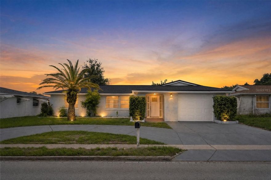 Welcome to this beautifully renovated home located in the desirable city of Holiday, perfectly positioned to enjoy the Florida lifestyle. Just minutes from beautiful beaches, popular restaurants, shopping centers, parks, and everyday conveniences, this property offers the ideal combination of luxury, comfort, and location. This move-in-ready home has been completely updated with high-end finishes throughout. Enjoy peace of mind with a brand-new A/C system and a new roof. Inside, the elegant 24x24 polished porcelain tile flooring creates a bright and modern feel that flows seamlessly through every room. The stunning kitchen has been fully redesigned with brand-new cabinets, sleek quartz countertops, porcelain backsplash, and new stainless steel appliances. A built-in wine cooler adds the perfect touch for entertaining family and friends. The spacious primary suite features a beautifully upgraded bathroom with glass-enclosed showers, a double vanity, and a stylish barn door that brings warmth and character to the space. Every detail of this home has been thoughtfully selected to create a modern yet welcoming atmosphere. Step outside and enjoy added privacy with a brand-new fence, perfect for relaxing, entertaining, or creating a secure outdoor space for pets and family gatherings. Whether you are looking for a primary residence, vacation home, or investment opportunity, this exceptional property offers modern upgrades, an unbeatable location. This is a rare opportunity to own a fully updated property that perfectly balances style, functionality, and comfort. Don't miss this opportunity !!!