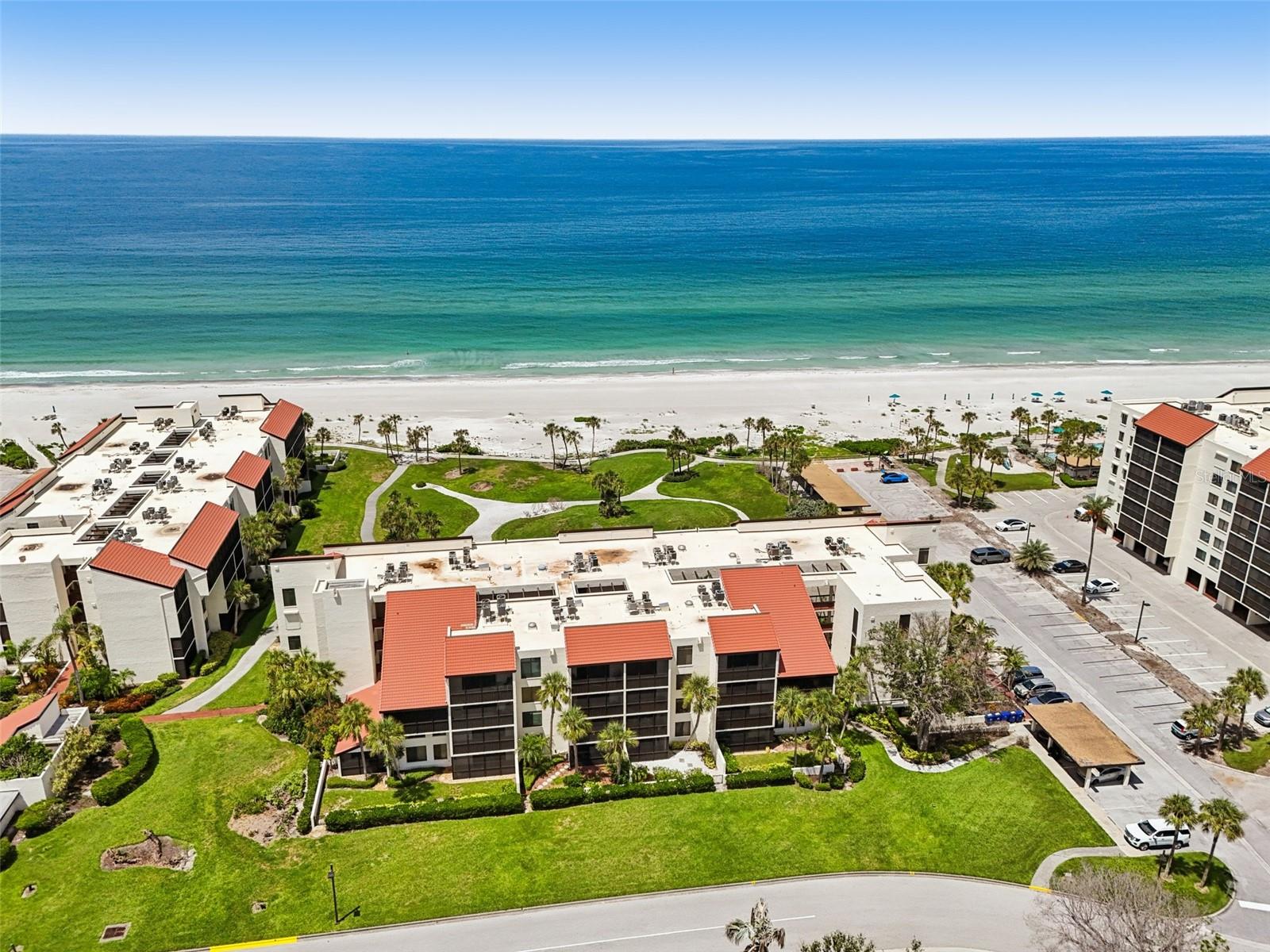 Here’s your chance to own a little slice of paradise on Longboat Key! This updated 2-bedroom, 2-bath condo is tucked into the sought-after Seaplace community—right on the sugar-white sands of the Gulf. Bright, open, and beachy, this coastal retreat has everything you need: an open layout, a spacious kitchen with stainless steel appliances, a comfy primary suite with a walk-in closet and en-suite bath, plus a private guest suite with its own bath. New LVP flooring in the main living areas and plush carpet in the bedrooms.
Step out to your screened lanai and soak in the tropical views of lush landscaping and the tennis courts—or take a few steps and you're on the beach! End your days with breathtaking sunsets and your toes in the sand.
Seaplace offers 42 acres of beautifully landscaped grounds, a half-mile of private beach, two heated pools and spas, and even a playground. The updated clubhouse has a gym, sauna, library, large kitchen, and a Gulf-front patio with grills. You’ll also love the Har-Tru tennis courts, walking trail, 24-hour gated entry, and on-site maintenance.
Plus, you're just minutes from local shops, Publix, and the amazing restaurants and boutiques at St. Armands Circle. Don’t miss your chance to live the laid-back coastal life—schedule your private tour today!