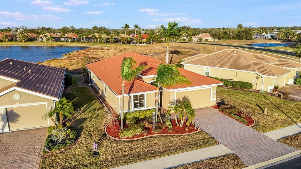 Photo of 7486 Talon Bay Drive, North Port, FL 34287 (MLS # C7530047)