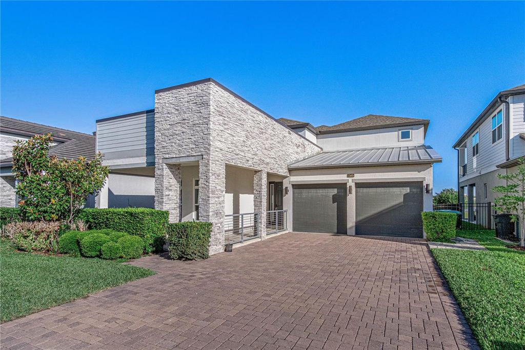 Photo of 7505 Alpine Butterfly Lane, Orlando, FL 32819 (MLS # O6400550)