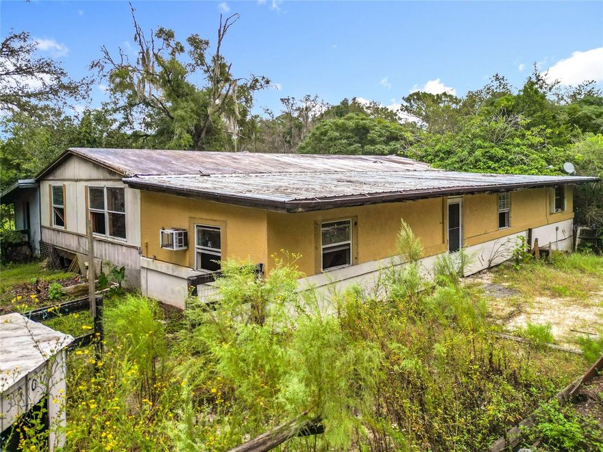 SELLER FINANCING AVAILABLE-1/2 DOWN-12 MONTH TERM-NO INTEREST-BUYER PAYS ALL CLOSING COSTS*NO CREDIT CHECK*INVESTOR SPECIAL/HANDYMAN SPECIAL*THIS HOME IS READY FOR YOUR VISION*COUNTRY SETTING ON 1.16 ACRE*DOUBLE WIDE WITH 2 ADDITIONS*LIKE 2 HOMES FOR THE PRICE OF ONE*OVER 3,400 SQFT*NO HOA*FRONT HOUSE FEATURES 3 BEDROOM, 2 BATH DOUBLE WIDE HOME PLUS A COVERED PORCH AND COVERED PATIO*REAR ADDITION FEATURES KITCHEN, LIVING, DINING, BEDROOM & BATH WITH SEPARATE ENTRANCE*HOME NEEDS TO BE NEEDS TO BE CLEANED OUT & REMODELED*IF YOU ARE HANDY & NEED THE SPACE-THIS HOME WILL BE WORTH THE WORK*CLOSE TO SHOPPING, HOSPITAL, ONLY 5 MILES FROM A WALMART SUPER CENTER. LOCATED 9 MILES FROM THE RAINBOW RIVER IN DUNNELLON, NEARBY IS THE WORLD EQUESTRIAN CENTER, AND 10 MINUTES TO OCALA WITH MAJOR SHOPPING STORES, MALLS AND RESTAURANTS*RAINBOW SPRINGS WITH A NATURAL SPRING FLOWING CRYSTAL CLEAR WATER*FISH THE MANY FRESHWATER LAKES OR THE GULF OF MEXICO FOR INSHORE AND OFFSHORE FISHING*HOME IS SOLD AS-IS