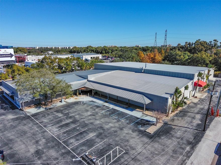 This multi-functional industrial showroom-warehouse is located in the heart of Pinellas County next to the new City Furniture with easy access to the surrounding Hillsborough, Sarasota, and Pasco Counties in the thriving Tampa Bay MSA. The site has outstanding visibility
from US Highway 19, a high-traffic roadway with over 90,000 cars passing by the site’s pylon signage and billboard daily. There
is approximately 218+ feet of direct highway frontage.

This exceptional property features a versatile corporate styled headquarters that can be used as a production or showroom
space with manufacturing/storage warehouse. Constructed in 2002, with an addition in 2019 and a comprehensive renovation
in 2023, it offers modern, sleek and efficient space for a variety of business needs.

The property boasts a total area of 31,018± square feet, strategically situated on a 1.76± acre lot. It is entirely climate controlled,
ensuring a comfortable and consistent environment throughout the year. There is also a billboard that transfers
with the property for use by the buyer or may continue to be rented out for additional income.

The showroom/production area has 9 high-end glassed private offices, large conference room, open showroom/bullpen
area, server room, and a nice upscale employee lounge/kitchen area with built in cabinetry. There are also men’s and women’s
multi-stall bathrooms. Ceiling heights are 10’ to 10’11’±.

The warehouse portion of the building has ceiling heights from 17’ to 23’± accommodating a wide range of industrial and
storage requirements. There is 3 phase power, multiple overhead doors for convenient loading and unloading: two measuring
8 x 8 feet, two at 10 x 10 feet, and one 8 x 10-foot door.

Key features of the building include:
•Extensive direct highway frontage of 218 feet, providing high visibility
•Daily traffic counts of 90,000+ cars
•Pylon signage and billboard income
•Robust infrastructure with 3-phase power, ideal for heavy machinery and equipment
•Multiple overhead doors for convenient loading/unloading: two measuring 8 x 8’, two at 10 x 10’, and one 8 x 10’ door
•Advanced safety features, including a comprehensive sprinkler system and a security setup with key fob entry, to ensure
the protection of assets and personnel

This listing represents a unique opportunity for businesses seeking a high-quality, versatile space in a prime Clearwater
location.