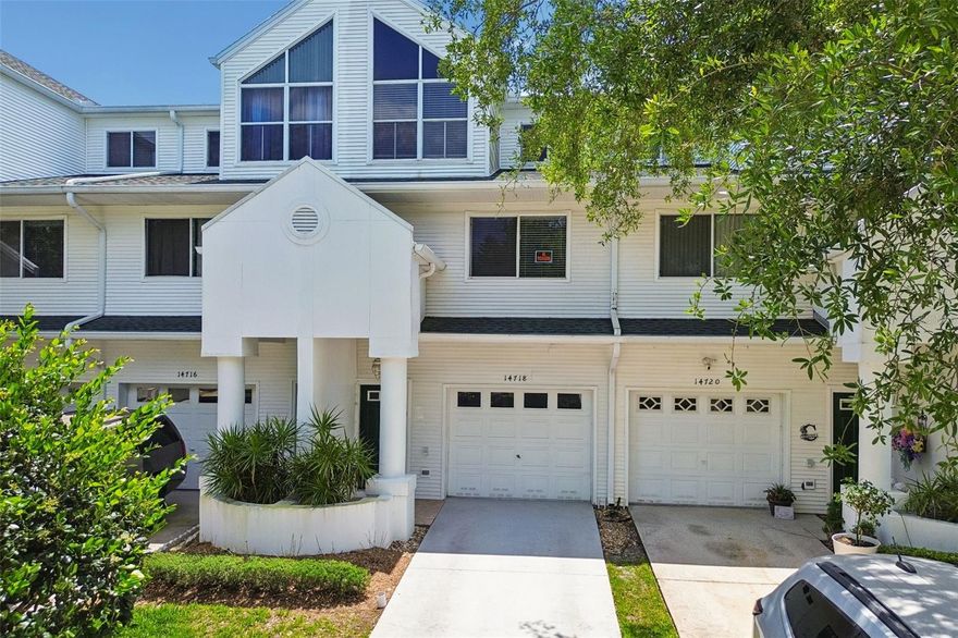 One or more photo(s) has been virtually staged. Best price in the complex!!! Tucked within a picturesque waterfront community, this charming three-story townhome offers a rare blend of space, flexibility, and setting. Surrounded by mature trees and peaceful, tree-lined streets, the location creates a serene backdrop for everyday living. Inside, you’ll find 4  generously sized bedrooms—three with its own attached bathroom—providing comfort and privacy that easily accommodates a variety of living arrangements. The main level has an open floorplan with the kitchen open to the dining room & living room, where you'll find sliders to the covered/screened balcony.  There is also a bedroom and bathroom on this floor.  On the first floor is a large primary bedroom & bathroom, along with it's own private patio.  On the top floor are two additional large bedrooms, one with its own private balcony and both with their own private bathrooms. Whether for guests, multi-generational living, or flexible use of space, the layout offers endless possibilities. The community pool is just steps from the unit. Less than 10 minute drive to beautiful Gulf Front beaches! 2 Car Tandem garage