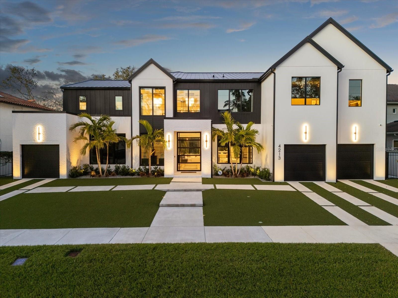 ***Accepting backup offers. Welcome to the pinnacle of luxury living! This ultra-luxury modern seven-bedroom, six and a half bath estate is located in the highly sought after neighborhood of Beach Park in South Tampa. This architectural masterpiece offers a one-of-a-kind exclusive residence to those who appreciate the finer things in life.
The custom designed masterpiece, created and fitted by Halo Homes and Modulo Design provides a unique experience as soon as you step in through the 10’ glass and steel custom front pivot door setting the tone for the grandeur within. The estate features an inviting, spacious, open floor plan with a light and airy ambience. Every corner has been curated with bespoke architectural elements, wide plank solid wood flooring, crystal chandeliers, handcrafted wooden fixtures with over one million dollars spent in upgrades. The home features a show kitchen and a chef's kitchen, which includes a sushi bar with brass accents. Both kitchens boast bespoke cabinetry, marble countertops and are fitted with top-of-the-line appliances (Wolf, Sub-Zero), also featuring a state-of-the-art Miele coffee bar.
This residence features multiple oversized living spaces, with floor-to-ceiling windows flooding the interiors with natural light. On the ground floor, the home has both formal and informal living and dining areas featuring a custom champagne wall and a marble liquor display with wine storage. The ground level also includes an en-suite guest bedroom, private gym and custom oversized elevator. The second level has two more en-suite bedrooms, a private cinema and a private luxurious master suite with his and hers separate walk-in wardrobes, marble bathroom and custom steam room. Outside, the property transforms into an entertainer’s paradise complete with a saltwater pool, oversized spa, sun shelf, lighting, speakers, turf landscaping, an outdoor kitchen with PVC cabinetry, oversized grille with a grand covered sun deck, luxe marble pavers and a 6’ block wall for privacy. Modern convenience meets peace of mind with the home’s smart technology, oversized attached outdoor AC storage room and hurricane proof windows. The property also has a higher elevation and remains completely unaffected by any hurricane, providing reassurance to homeowners. Furnishings available on separate contract.
Situated in South Tampa, this home is just minutes from the area’s best restaurants, vibrant nightlife, shopping and top-rated schools. This estate is second to none, with a host of elegant and details that make it an exceptional home for the most discerning luxury property buyers. Please enjoy video of the home under the virtual tour link.