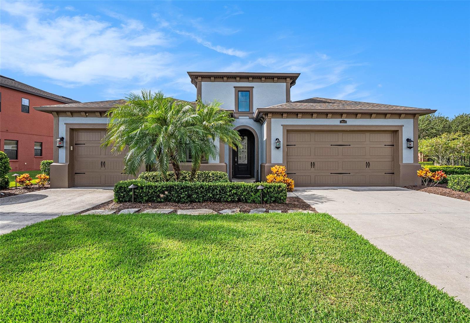 One or more photo(s) has been virtually staged. Stunning 4-Bedroom Pool Home in Sought-After Estancia at Wiregrass
Welcome to your dream home in the coveted Estancia at Wiregrass community in Wesley Chapel! This beautifully maintained 4-bedroom, 3-bathroom home spans 2584 square feet of elegant living space and offers the perfect blend of luxury, comfort, and functionality. This residence sits on a manicured corner lot in one of Wesley Chapel’s most desirable upscale neighborhoods. From the moment you arrive, you’ll be captivated by the curb appeal, mature landscaping, and welcoming entryway. A long foyer w/ double chandeliers welcomes you into a spacious open-concept floor plan with 10' ceilings and abundant natural light. The gourmet kitchen features a gas range, double ovens, granite countertops, stainless steel appliances, a large center island w/ touchless faucet, and a walk-in pantry. The primary suite provides privacy with an entry way, a tray ceiling, oversized walk-in closet, and a view of the pool and backyard. The master bath features a split vanity design with soaking tub and upgraded shower w/ a built-in seat and designer tilework. Three additional bedrooms with new carpet provides privacy plus an additional flex room with custom built-in wall to wall shelves is perfect for a home office, playroom, or media space. The family room boasts electric curtains, remote light/fan, surround sound speakers, and in-wall wiring for mounting a TV while providing a beautiful view of the pool and lanai. New carpet, Upgraded tile floors, crown molding, recessed lighting are complemented by plantation blinds and arched hallways. The Screened-in lanai overlooks a private, resort-style pool with 3 fountains, built-in seating and stairs – perfect for relaxing or entertaining year-round. Professionally landscaped yard with irrigation system boasts turf in the backyard for easy maintenance and a custom putting green for tons of fun. The 3 car split garage comes with overhead storage shelves. The Club at Estancia offers a premier lifestyle with resort-caliber amenities including a stylish clubhouse with fitness center, resort-style pool, tennis courts, playgrounds, and more. Conveniently located just minutes from Wiregrass Mall, AdventHealth, top-rated schools, dining, and provides easy access to I-75 for a quick commute to downtown Tampa. Don’t miss your chance to live in one of Wesley Chapel’s most coveted neighborhoods. Schedule your private showing today and experience the Estancia lifestyle!