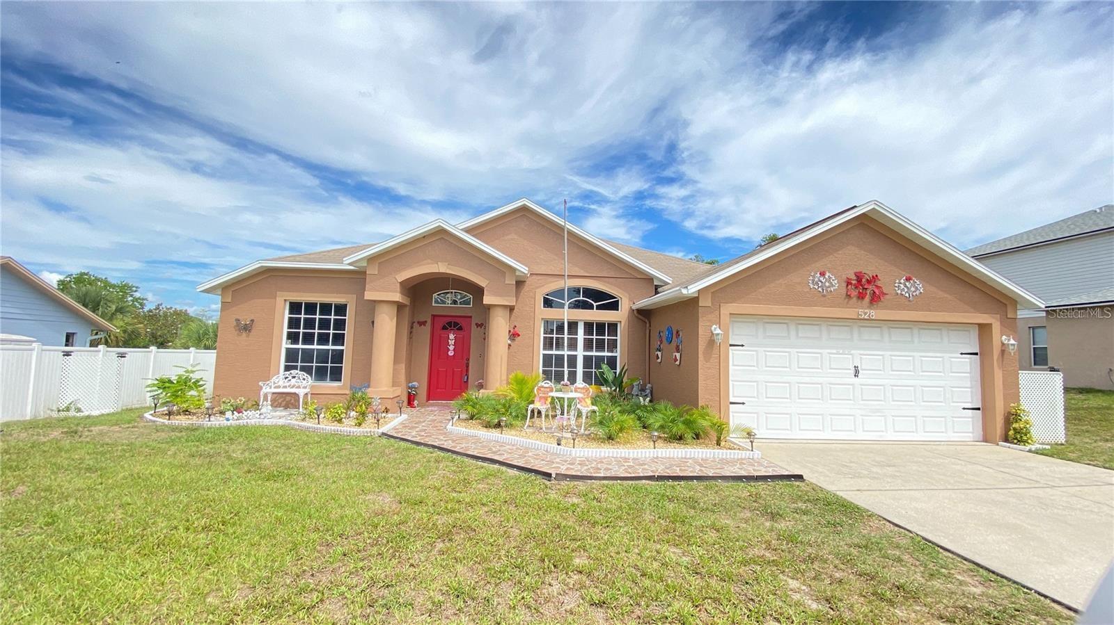 Come see this lovely 4 bedroom / 2 bath, one story home in desirable Deltona Lakes community, resting on a .22 acre lot! NEWER A/C, KITCHEN APPLIANCES, WASHER & DRYER* NEW granite countertops, Exterior painted - November 2021. Super spacious, open floor plan! Chef's delight kitchen with tons of cabinets and countertops is open to the family room, perfect for gathering! This perfect home also features a breakfast bar in kitchen, dual sinks in the master bath, a covered screened lanai, and a 2 car attached garage! Beautiful laminate & ceramic flooring! Outdoor sink located on the paved rear patio, great for entertaining in this amazing Florida weather! Check out all that this home has to offer! See for yourself, TODAY!