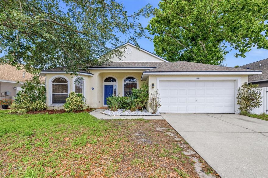 Welcome Home to this 4-bedroom, 2-bath POOL home in the highly desirable gated community of Forest Ridge in Tarpon Springs! From the moment you enter, you'll appreciate the open layout (which includes a split-bedroom floorplan), vaulted ceilings, recessed lighting, and newer luxury vinyl flooring throughout the main living areas. The kitchen features wood cabinetry, granite countertops, and overlooks the family room and breakfast nook, making it the perfect setup for everyday living and entertaining. The spacious family room offers a wood-burning fireplace, vaulted ceilings, and direct access to the screened lanai and pool area through oversized sliding glass doors. The large, private primary suite features a vaulted ceiling, ceiling fan, recessed lighting, direct lanai access, a walk-in closet and an en-suite bathroom complete with dual sinks, a soaking tub, a walk-in shower, and a separate water closet. Directly connected to the primary bath is a bright secondary bedroom with three large arched windows, making it a highly flexible space ideal for a nursery, home office or private sitting room. Two other spacious bedrooms are on the opposite side of the home and can share a full 4-piece bathroom complete with tub/shower combo. Step outside into your own private oasis and experience Florida living at its finest! The expansive, screened-in lanai features a sparkling pool and a generous deck—perfect for unwinding in the shade or hosting unforgettable gatherings with family and friends. Major updates include a NEWER ROOF (2019) and HVAC (2018). Forest Ridge is one of Tarpon Springs' most sought-after gated communities, conveniently located near the Sponge Docks, waterfront parks, restaurants, shopping, medical facilities, and approximately 45 minutes to Tampa International Airport. Call now to schedule your private showing!  Don't let this one get away!