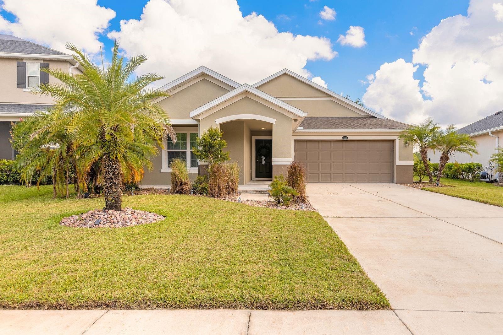 Enjoy the Amazing Lake Views from this Beautiful Three Bedroom Two Bath Home in Grande Champion Subdivision. A Quiet, Peaceful Neighborhood Located within LPGA Golf Community! Greet Family and Friends on your Covered Front Porch or Relax on your Oversized Back Porch Overlooking the Lake with its Stunning Views! Open Floor Plan. Vaulted Ceilings in the Living Room, Kitchen and Dining Room. Crown Molding in Main Areas. Kitchen has Beautiful Cabinetry, Stainless Steel Appliances, Granite Counters & Tile Backsplash. Master Retreat has His and Hers Walk in Closets, Master Bath has Double Vanities. Split Floorplan. Inside Laundry. Very Convenient Location. Located Close to Everything Daytona Has Available, Including the Most Famous Beach!