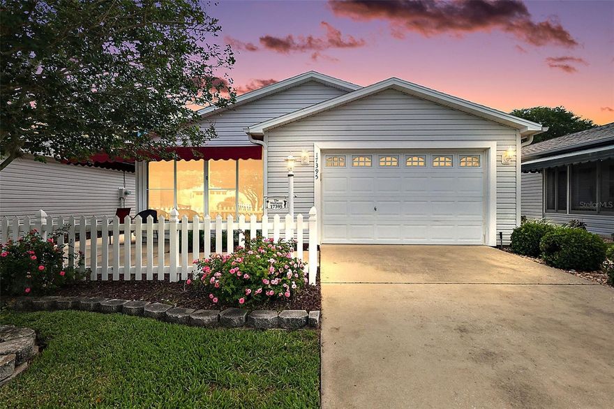 Wonderful FURNISHED 2/2 Cabot Cove Patio Villa with ENCLOSED UNDER-AIR LANAI, INTERIOR LAUNDRY, and SPACIOUS FRONT and SIDE PATIOS with REAR PRIVACY LANDSCAPING in the sought-after Village of Piedmont! EXTREMELY LOW BOND- only $786.05! HWH (2023). ROOF (2020). HVAC (2017) Welcoming you to this AMAZING home are a CHARMING white picket fence and EXPANSIVE FRONT and SIDE PATIOS complete with a convenient awning and REAR PRIVACY LANDSCAPING offering the perfect setting for soaking up the Florida sunshine or hosting lively gatherings with friends and family! From the patio, enter the FRONT ENCLOSED LANAI. This bright, UNDER-AIR room features three sets of double windows fitted with solar shades, a ceiling fan for added comfort, and a freshly painted floor. Whether you’re enjoying your morning coffee, unwinding with an evening drink, or getting lost in a good book, this versatile space is designed for year-round relaxation! Enter through the front door into the OPEN CONCEPT floor plan of the living, dining, and kitchen. This SPACIOUS main living area boasts gorgeous ENGINEERED HARDWOOD flooring, two sets of DOUBLE windows, and a set of sliding glass doors for ABUNDANT NATURAL LIGHT! The AMAZING kitchen boasts WHITE cabinetry, LARGE PANTRY closet, and an EAT-IN breakfast bar. The primary bedroom features LUXURY VINYL PLANK flooring and a  GENEROUS WALK-IN closet. It’s en-suite bathroom is well-appointed with WHITE cabinetry and a WALK-IN shower. Bedroom two features LUXURY VINYL PLANK flooring and a built-in closet. The second bathroom offers a WHITE vanity, tub and shower combination, and a hallway LINEN closet. A CONVENIENT INTERIOR LAUNDRY room offers additional shelving for EXTRA STORAGE needs. Completing the package is an 18’x23’ one and a half car garage with attic access and stairs, WHITE cabinets, and PLENTY of space for a car and golf cart! DON’T MISS YOUR OPPORTUNITY TO MAKE THIS WONDERFUL HOME YOUR OWN! The Village of Piedmont is CONVENIENTLY LOCATED close Close to Nancy Lopez Legacy Country Club and Championship Golf Course; Glenview Country Club and Championship Golf Course; numerous executive golf courses; First Responders Regional Recreation Center and Pitch-N-Putt Golf Course; Chatham and Mulberry Grove Pools and Recreation Centers; Calumet Grove Neighborhood Pool; the Savannah Center; Springdale Fitness and Walking Trails; Mulberry Dog Park; the VA Hospital; and CR 42 with an abundance of shopping, restaurants, banking, medical, and more! PLEASE WATCH OUR WALKTHROUGH VIDEO of this FANTASTIC HOME and call today to schedule your Private Showing or Virtual Tour!