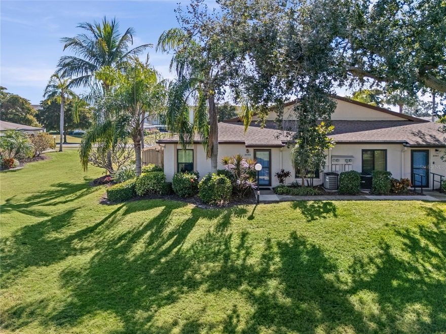 Extensively renovated, maintenance-free villa-style residence located in desirable Country Village, a highly active 55+ community—ideal for lock-and-leave or seasonal ownership. Over $40,000 in upgrades were completed in September 2025, creating a truly move-in-ready opportunity.

Interior enhancements include new hurricane-impact PGT windows throughout, 9-inch wide-plank luxury vinyl flooring, fresh interior paint, upgraded 5-inch woodwork, and solid wood interior doors with updated hardware.

The kitchen is fully equipped with new LG appliances, including refrigerator, dishwasher, microwave, air-fryer range, washer, and dryer, and is accented by a new dining room chandelier. Bathrooms have been thoughtfully updated with new vanities, toilets, mirrors, faucets, and a newly tiled shower pan.

Additional improvements include plantation-style louvered pantry and closet bifold doors, decorative paddle-style electrical outlets and switches, adjustable metal closet shelving, recently cleaned HVAC vents and ducts, and an HVAC system professionally serviced every six months by LPAC Bradenton. Backflow inspection completed October 2025.

Enjoy the enclosed lanai, recently rescreened and finished with new outdoor carpet—an inviting space to relax year-round. Exterior upgrades include a new front door with updated hardware and an exterior storm/screen door. Community improvements include parking lot resurfacing and restriping completed in 2025.

The villa is ideally positioned within the association, surrounded by mature tropical landscaping and tranquil greenbelt views, with no adjacent roadways or parking areas. A private walkway leads directly to the front entrance, and an assigned covered parking space provides everyday convenience. The bright courtyard and professionally maintained grounds reinforce the low-maintenance lifestyle.

Country Village offers an active 55+ community atmosphere with convenient access to local beaches, dining, shopping, and popular attractions. A thoughtfully upgraded property designed for ease of ownership, quality, and peace of mind.